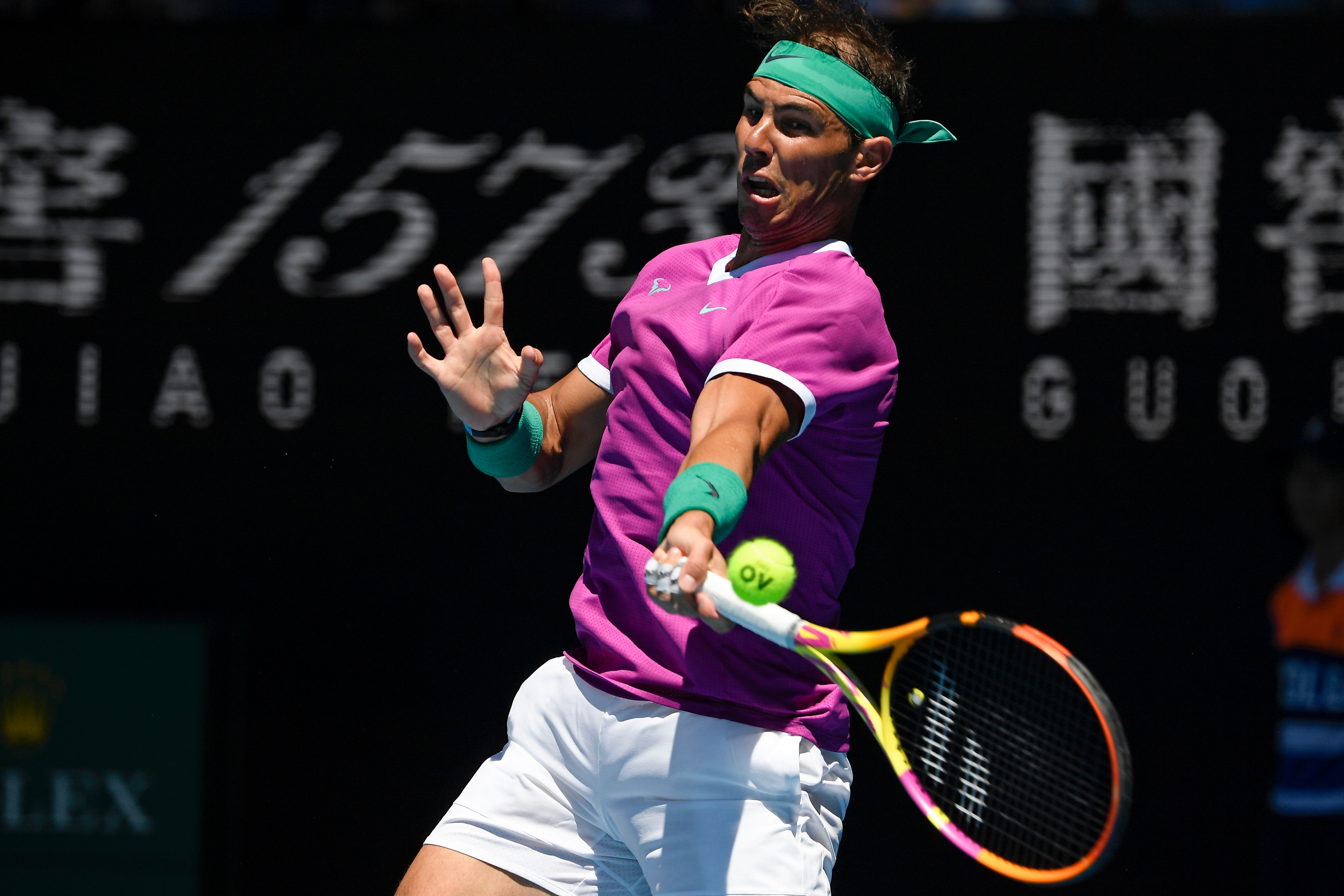 Rafael Nadal of Spain plays a forehand return to Yannick Hanfmann of Germany during their second round match at the Australian Open tennis championships in Melbourne, Australia, Wednesday, Jan. 19, 2022. (AP Photo/Andy Brownbill)