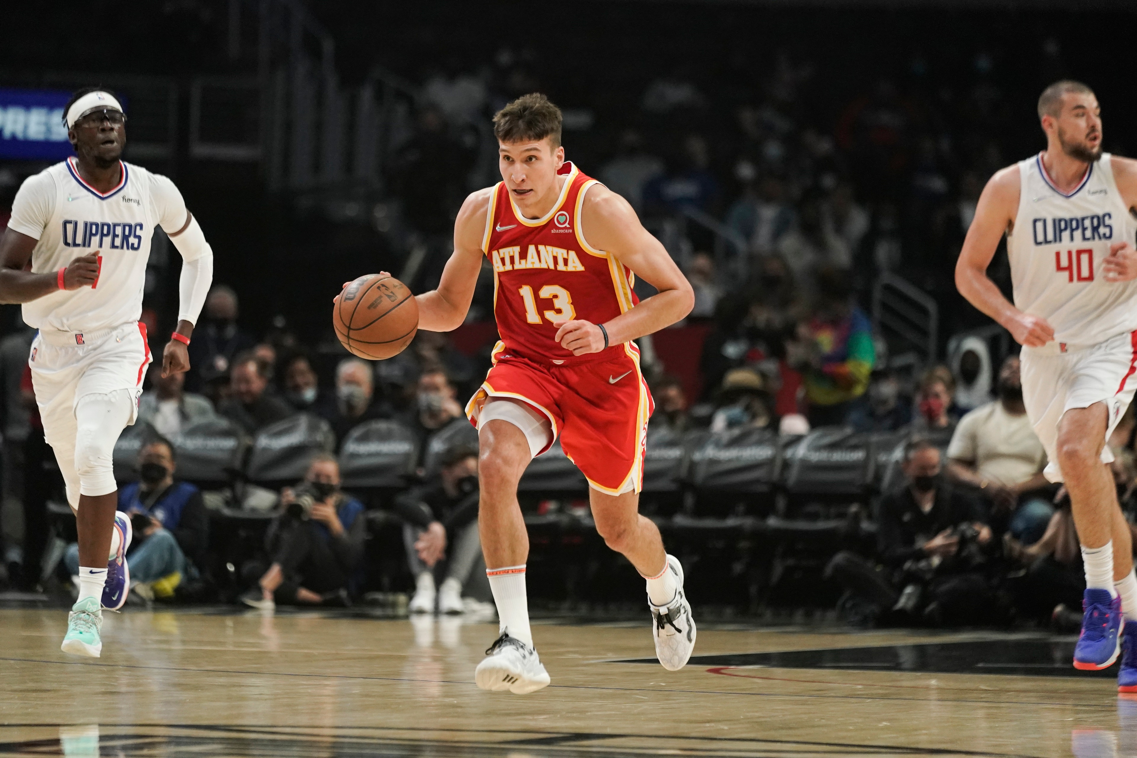 Atlanta Hawks' Bogdan Bogdanovic makes his way down the court during first half of an NBA basketball game against the Los Angeles Clippers Sunday, Jan. 9, 2022, in Los Angeles. (AP Photo/Jae C. Hong) Atlanta Hawks' Bogdan Bogdanovic makes his way down the court during first half of an NBA basketball game against the Los Angeles Clippers Sunday, Jan. 9, 2022, in Los Angeles. (AP Photo/Jae C. Hong)