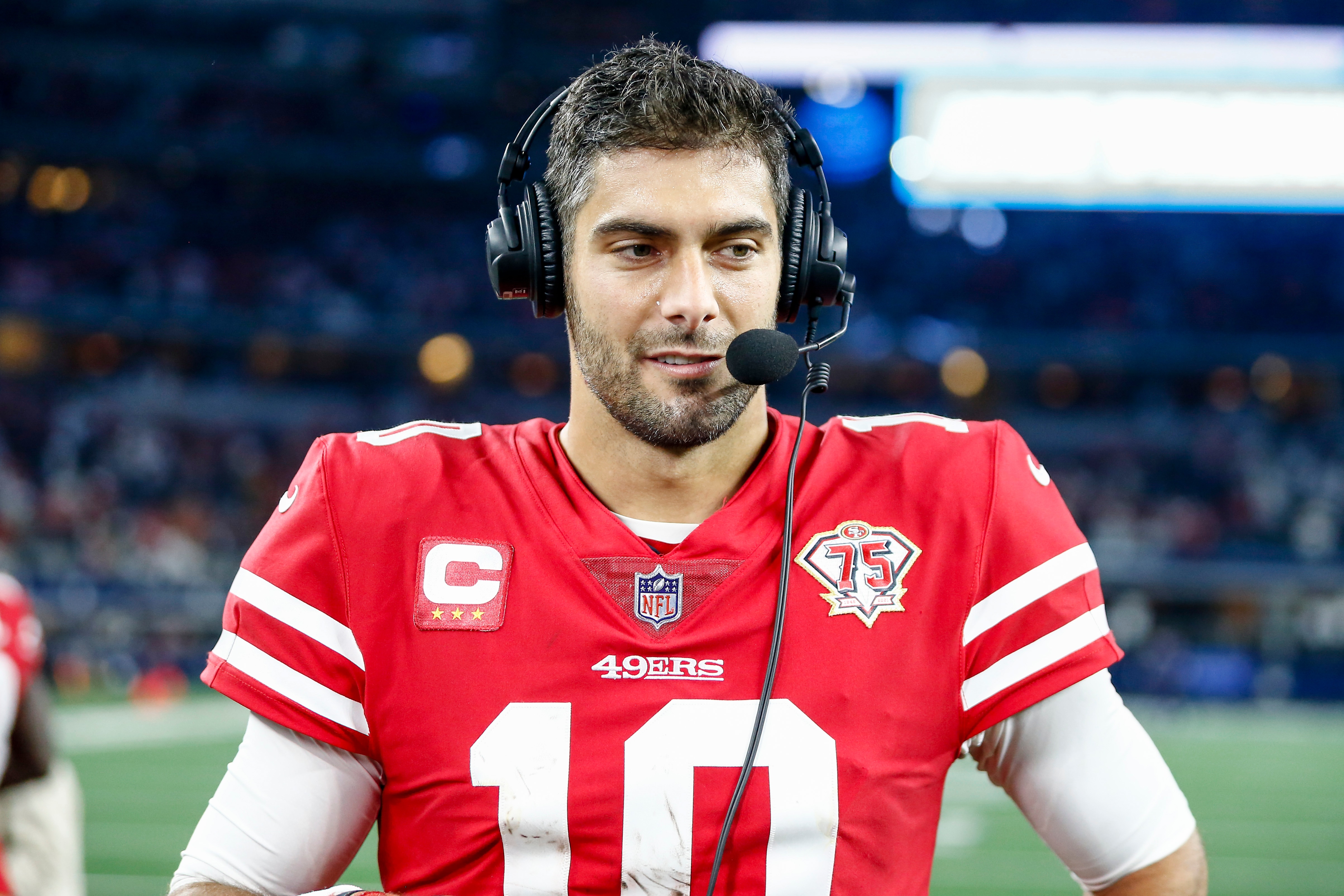 ARLINGTON, TX - JANUARY 16: San Francisco 49ers quarterback Jimmy Garoppolo (10) does an interview after winning the NFC Wild Card game between the Dallas Cowboys and the San Francisco 49ers on January 16, 2022 at AT&T Stadium in Arlington, Texas. (Photo by Matthew Pearce/Icon Sportswire via Getty Images) ARLINGTON, TX - JANUARY 16: San Francisco 49ers quarterback Jimmy Garoppolo (10) does an interview after winning the NFC Wild Card game between the Dallas Cowboys and the San Francisco 49ers on January 16, 2022 at AT&T Stadium in Arlington, Texas. (Photo by Matthew Pearce/Icon Sportswire via Getty Images)