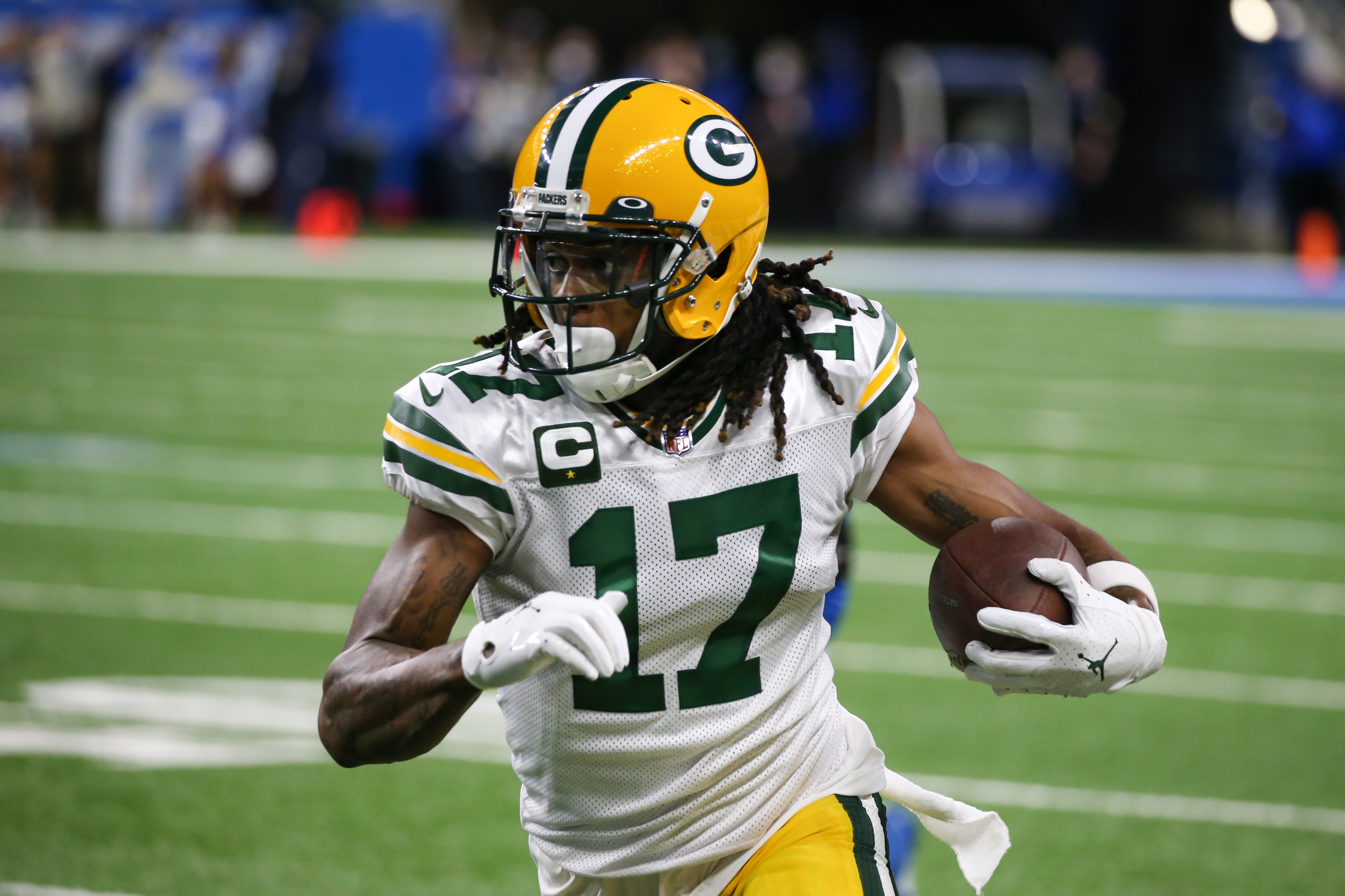 DETROIT, MI - JANUARY 09:  Green Bay Packers wide receiver Davante Adams (17) runs with the ball after catching a pass during a regular season NFL game between the Green Bay Packers and the Detroit Lions on January 9, 2022 at Ford Field in Detroit, Michigan.  (Photo by Scott W. Grau/Icon Sportswire via Getty Images)