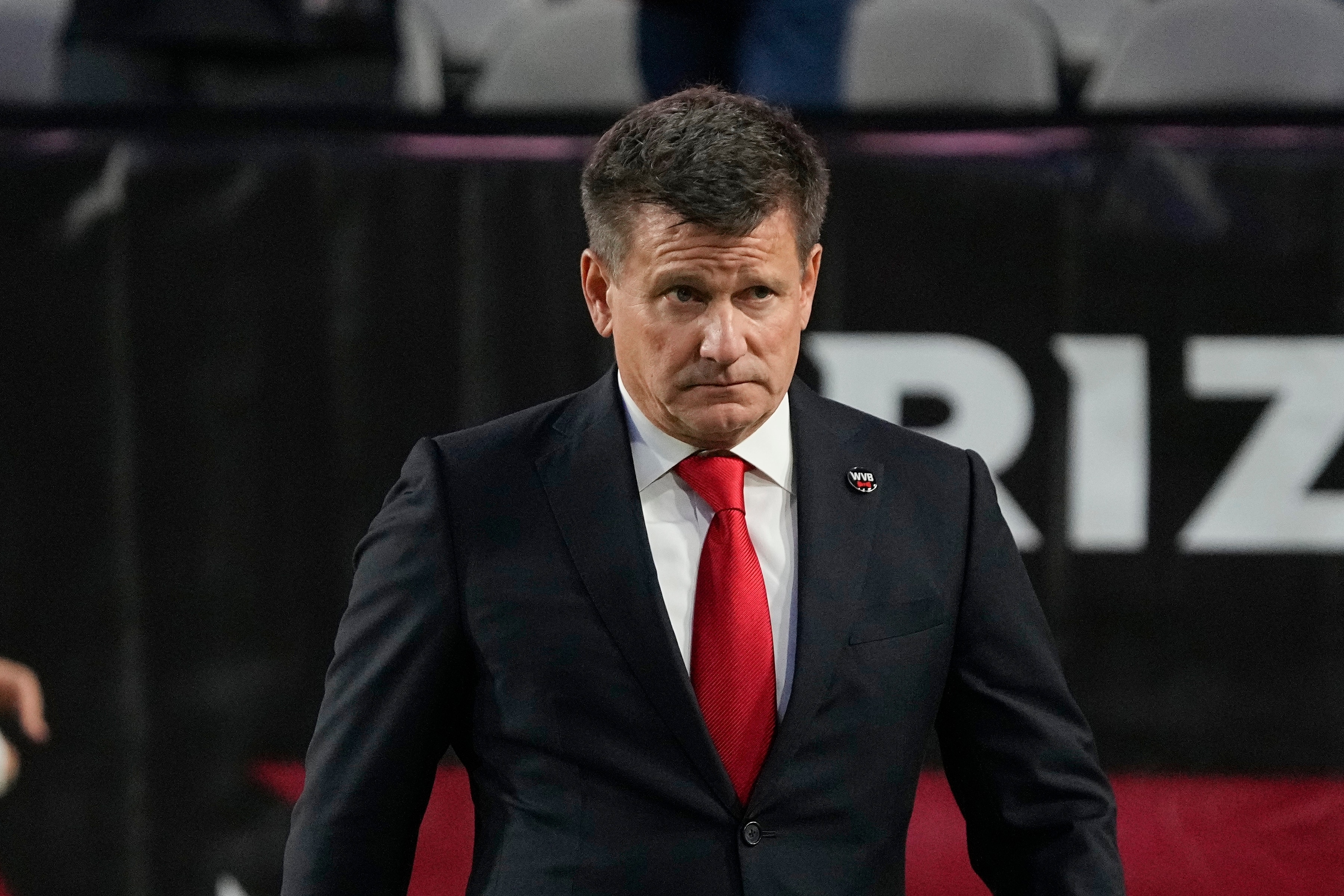 Arizona Cardinals owner Michael Bidwill walks on the field prior to an NFL football game against the Los Angeles Rams Monday, Dec. 13, 2021, in Glendale, Ariz. (AP Photo/Rick Scuteri)