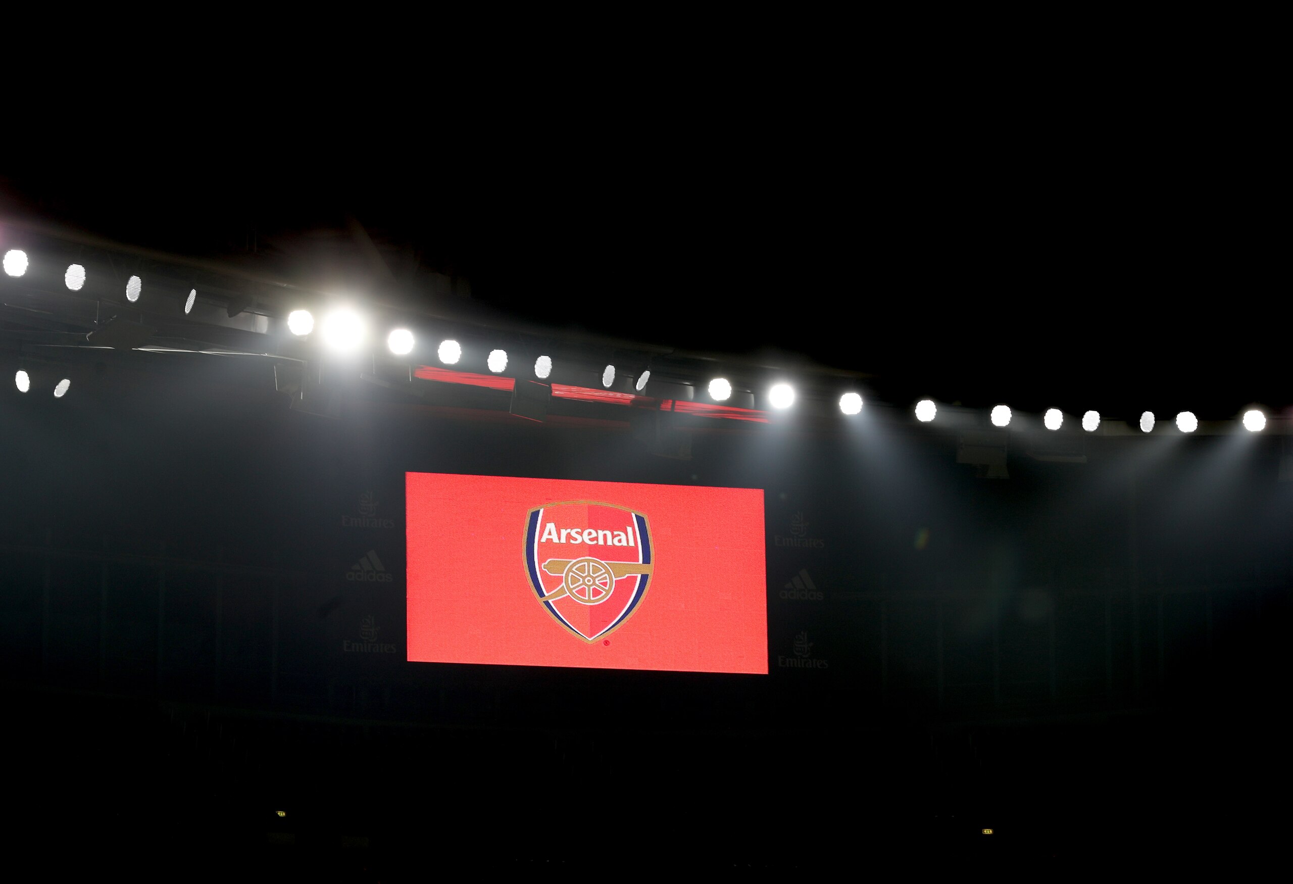 LONDON, ENGLAND - NOVEMBER 29: The Arsenal logo is seen on the LED screen prior to the Premier League match between Arsenal and Wolverhampton Wanderers at Emirates Stadium on November 29, 2020 in London, England. Sporting stadiums around the UK remain under strict restrictions due to the Coronavirus Pandemic as Government social distancing laws prohibit fans inside venues resulting in games being played behind closed doors. (Photo by Catherine Ivill/Getty Images) LONDON, ENGLAND - NOVEMBER 29: The Arsenal logo is seen on the LED screen prior to the Premier League match between Arsenal and Wolverhampton Wanderers at Emirates Stadium on November 29, 2020 in London, England. Sporting stadiums around the UK remain under strict restrictions due to the Coronavirus Pandemic as Government social distancing laws prohibit fans inside venues resulting in games being played behind closed doors. (Photo by Catherine Ivill/Getty Images)