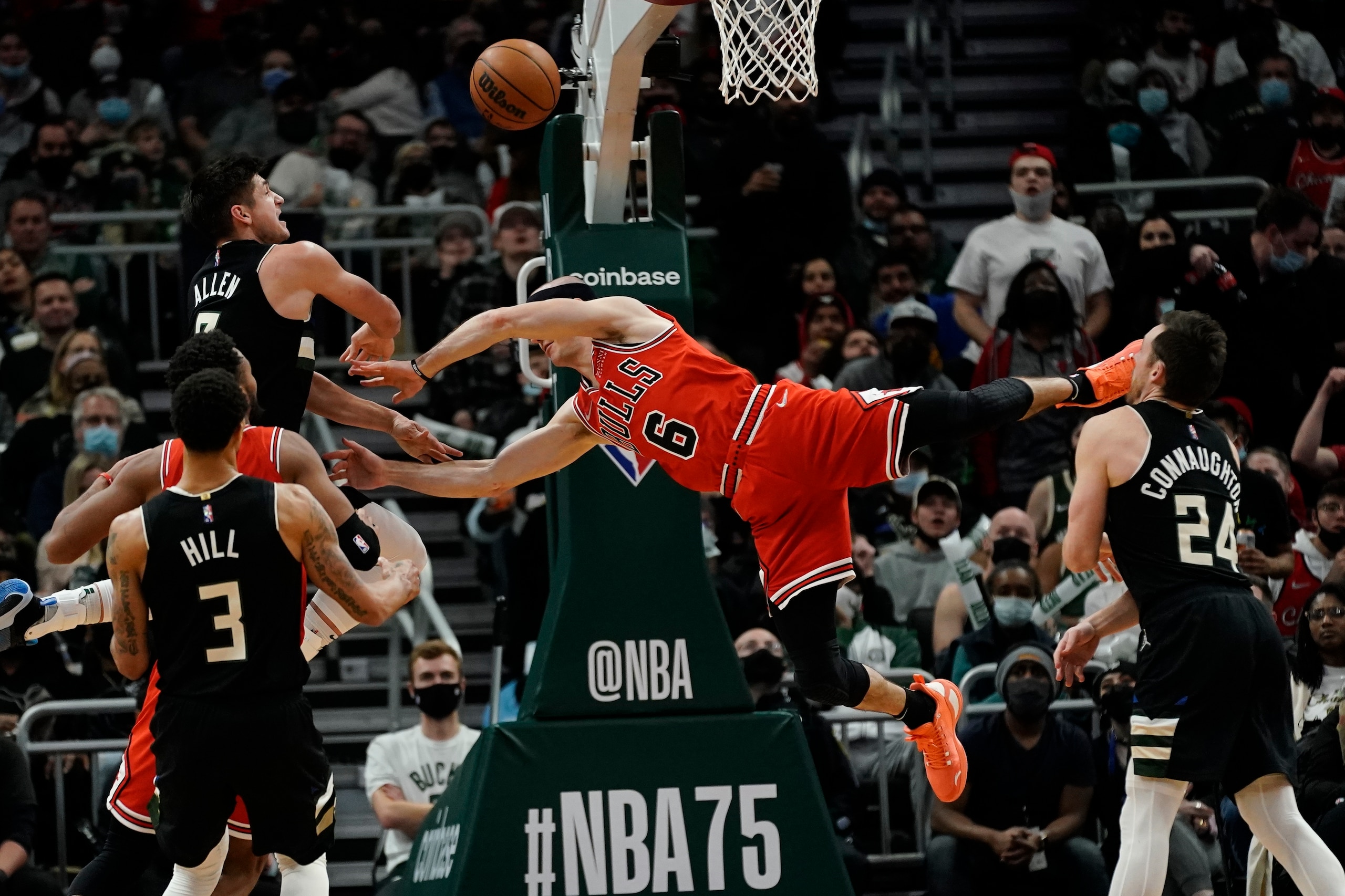 Milwaukee Bucks' Grayson Allen fouls Chicago Bulls' Alex Caruso during the second half of an NBA basketball game Friday, Jan. 21, 2022, in Milwaukee. The Bucks won 94-90. (AP Photo/Morry Gash)