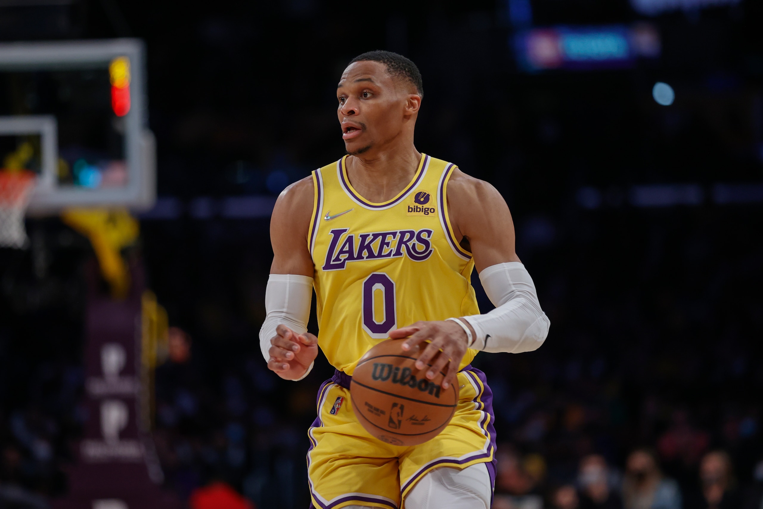 Los Angeles Lakers guard Russell Westbrook (0) dribbles the ball against the Utah Jazz during the second half of an NBA basketball game in Los Angeles, Monday, Jan. 17, 2022. The Lakers won 101-95. (AP Photo/Ringo H.W. Chiu)