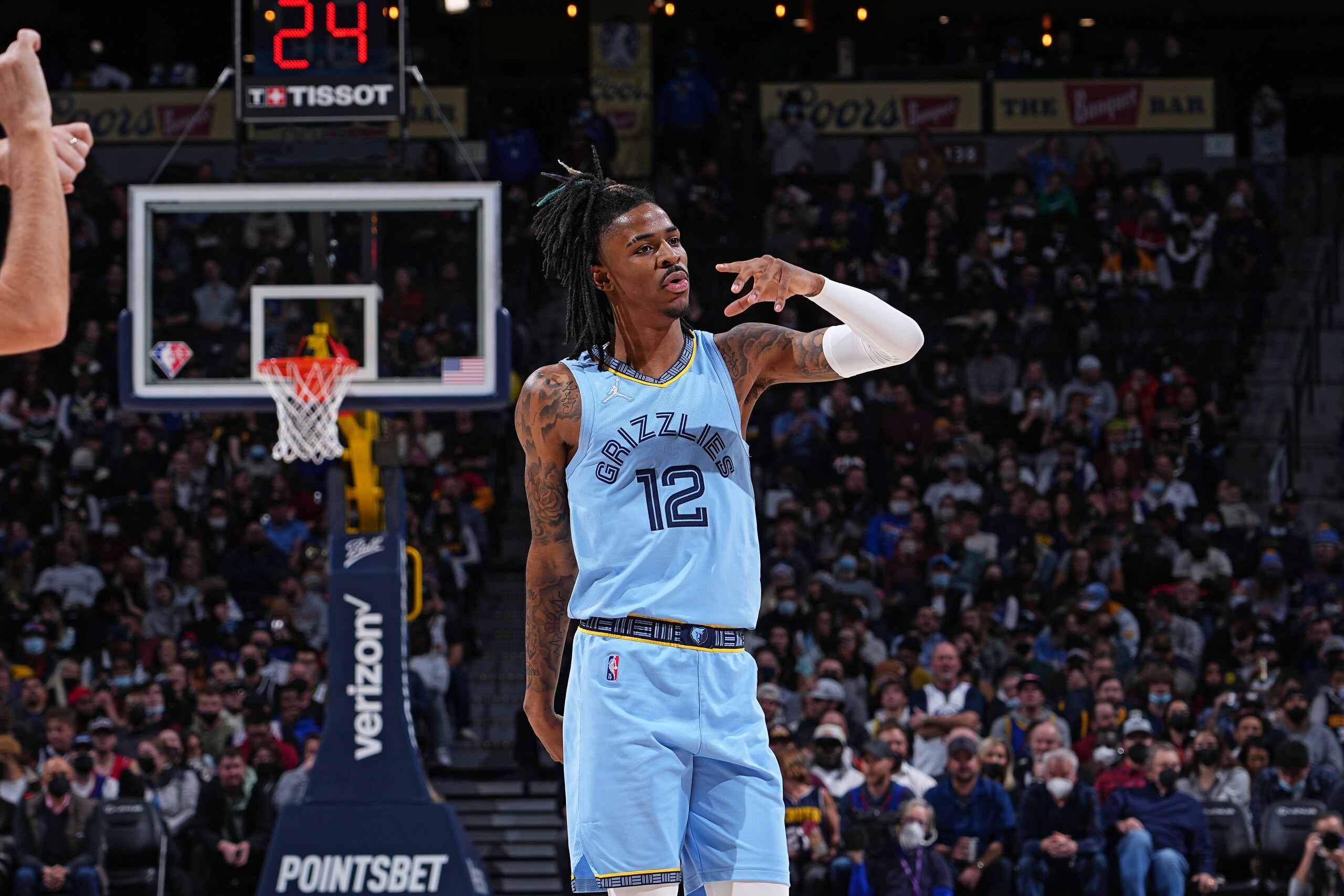 DENVER, CO - JANUARY 21: Ja Morant #12 of the Memphis Grizzlies reacts during a game against the Denver Nuggets on January 21, 2022 at the Ball Arena in Denver, Colorado. NOTE TO USER: User expressly acknowledges and agrees that, by downloading and/or using this Photograph, user is consenting to the terms and conditions of the Getty Images License Agreement. Mandatory Copyright Notice: Copyright 2022 NBAE (Photo by Bart Young/NBAE via Getty Images) DENVER, CO - JANUARY 21: Ja Morant #12 of the Memphis Grizzlies reacts during a game against the Denver Nuggets on January 21, 2022 at the Ball Arena in Denver, Colorado. NOTE TO USER: User expressly acknowledges and agrees that, by downloading and/or using this Photograph, user is consenting to the terms and conditions of the Getty Images License Agreement. Mandatory Copyright Notice: Copyright 2022 NBAE (Photo by Bart Young/NBAE via Getty Images)