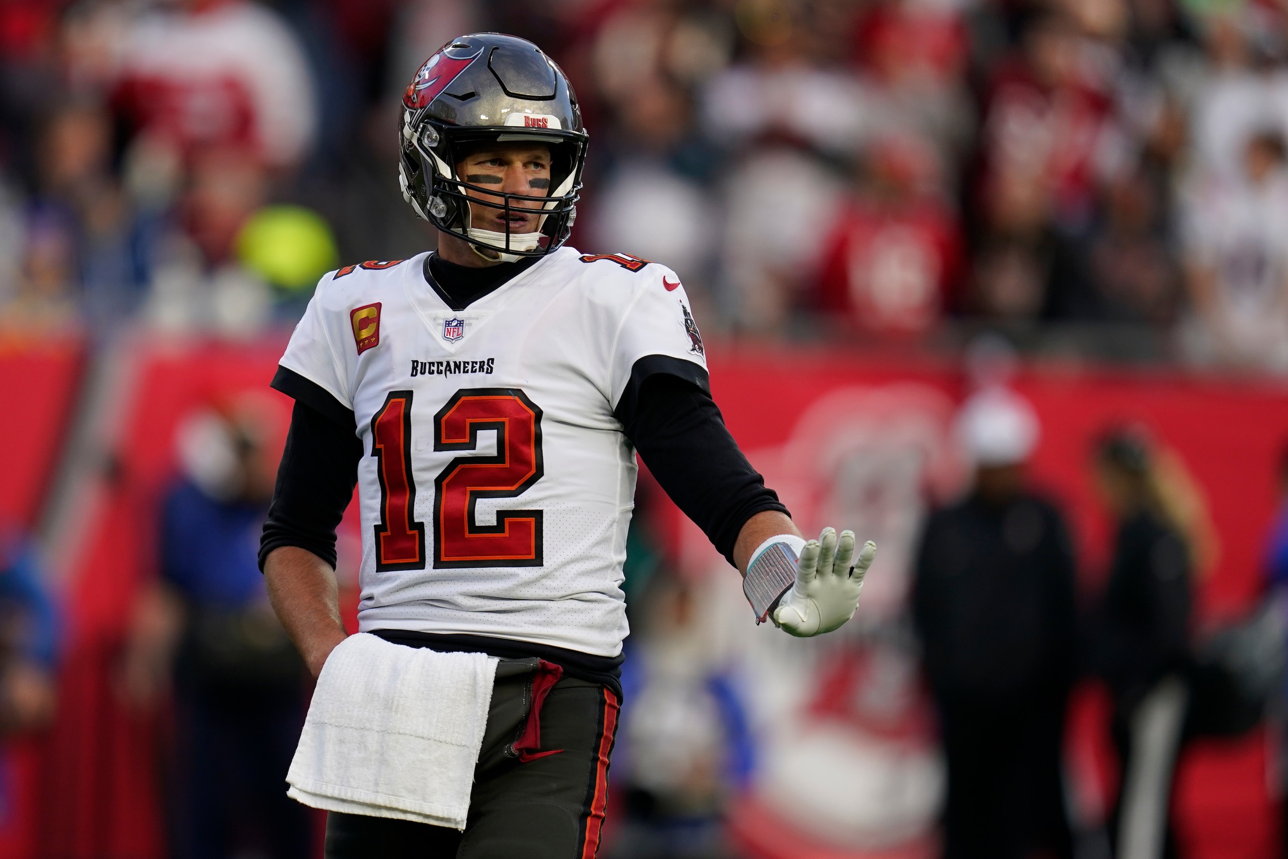 Tampa Bay Buccaneers quarterback Tom Brady (12) reacts during the second half of an NFL divisional round playoff football game against the Los Angeles Rams Sunday, Jan. 23, 2022, in Tampa, Fla. (AP Photo/John Raoux)