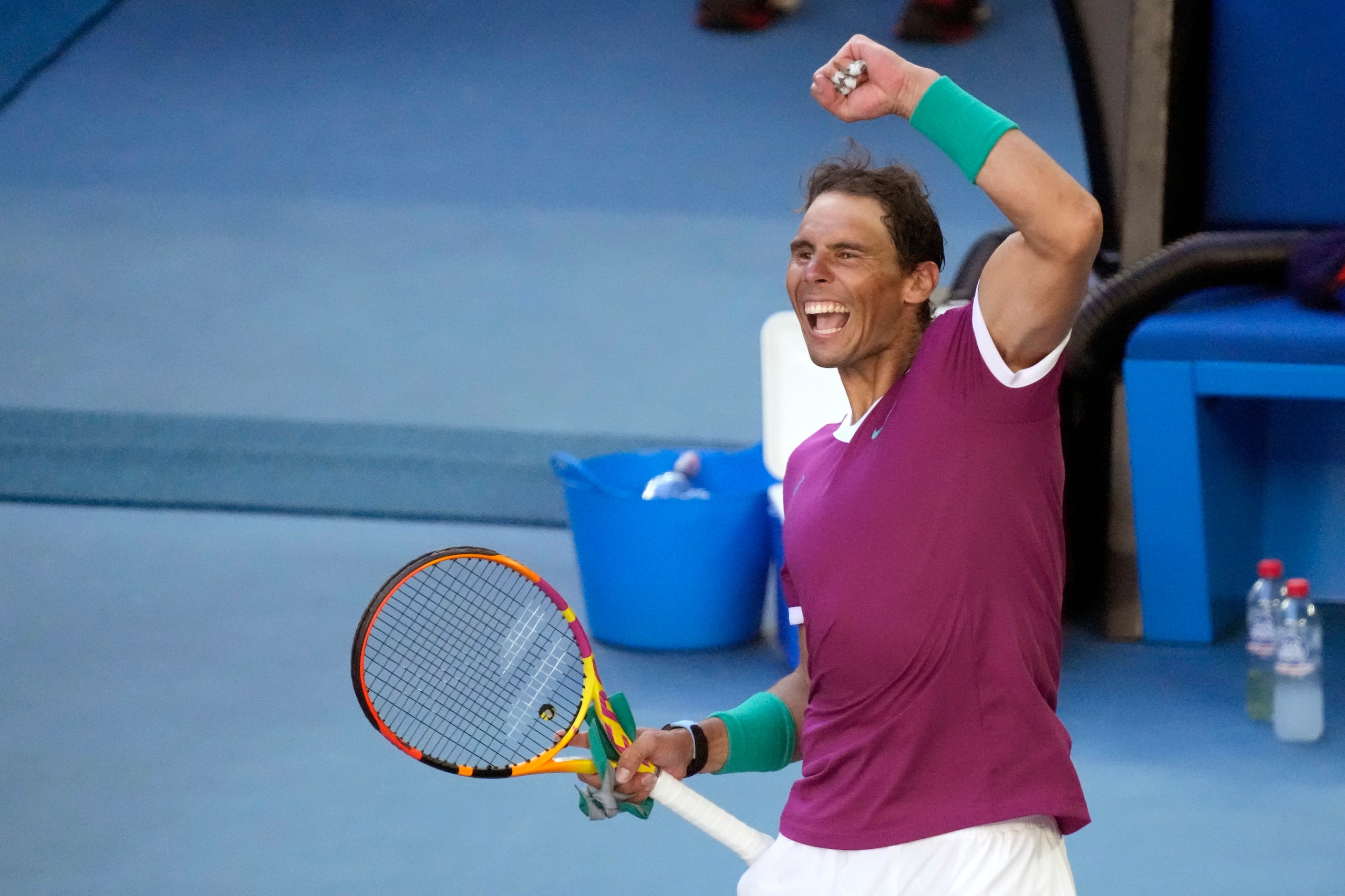 Rafael Nadal of Spain celebrates after defeating Denis Shapovalov of Canada in their quarterfinal match at the Australian Open tennis championships in Melbourne, Australia, Tuesday, Jan. 25, 2022.(AP Photo/Simon Baker)