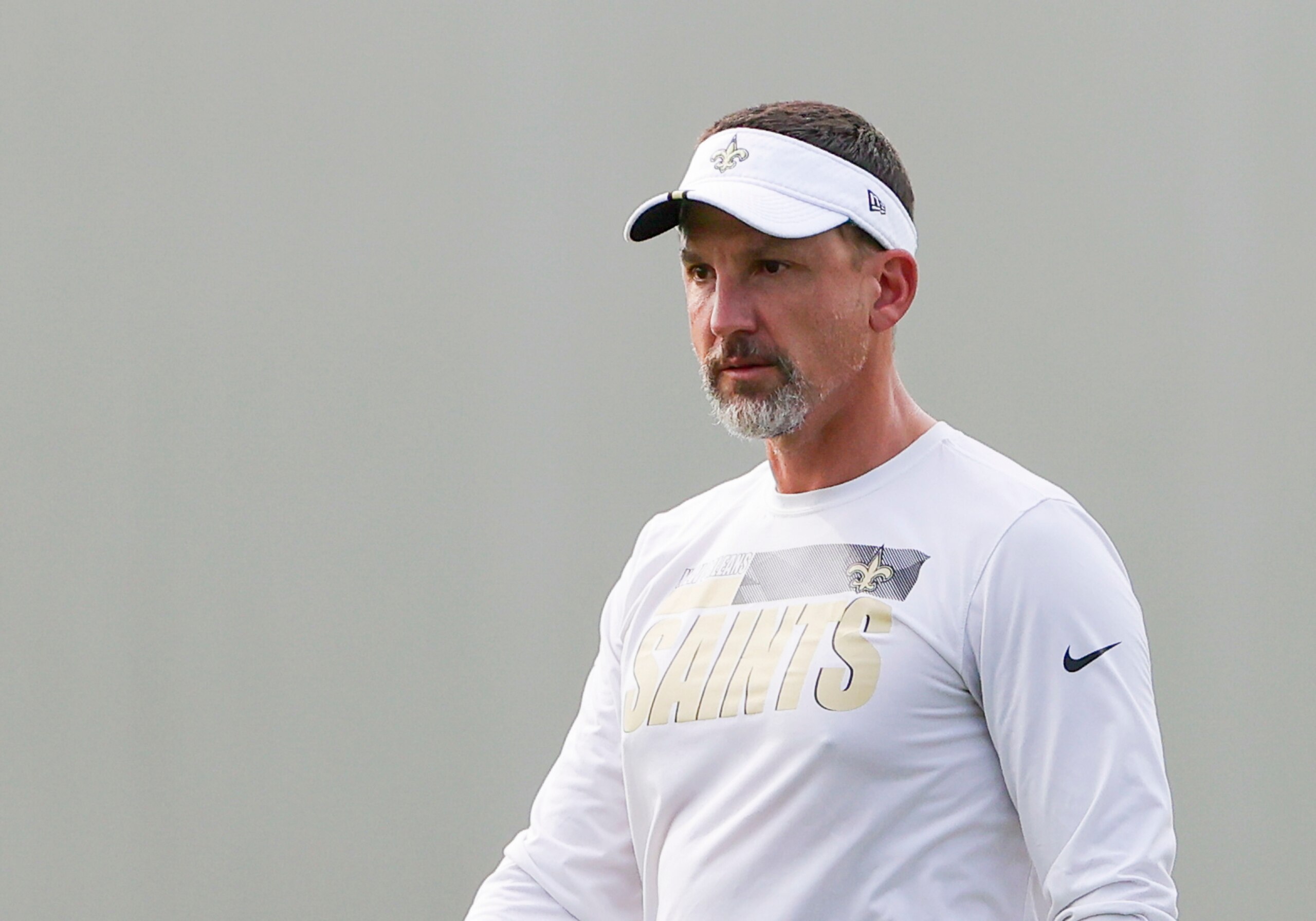 New Orleans Saints defensive coordinator Dennis Allen watches practice during NFL football training camp in Metairie, Friday, July 30, 2021. (AP Photo/Derick Hingle)