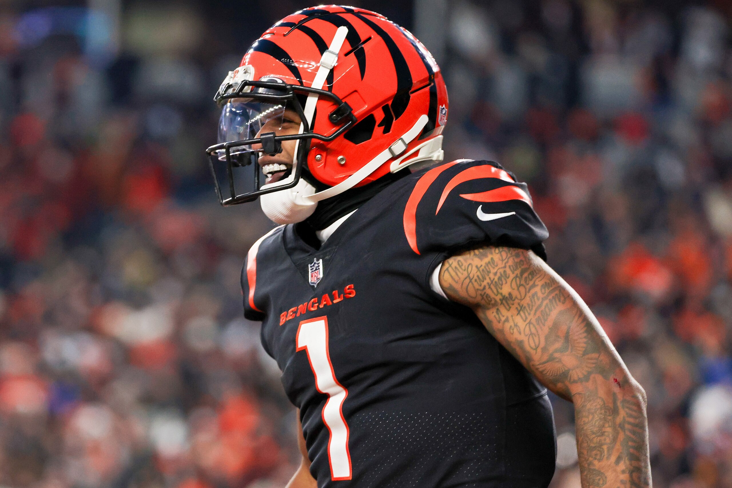 CINCINNATI, OHIO - JANUARY 15: Ja'Marr Chase #1 of the Cincinnati Bengals celebrates in the second quarter against the Las Vegas Raiders during the AFC Wild Card playoff game at Paul Brown Stadium on January 15, 2022 in Cincinnati, Ohio. (Photo by Dylan Buell/Getty Images)
