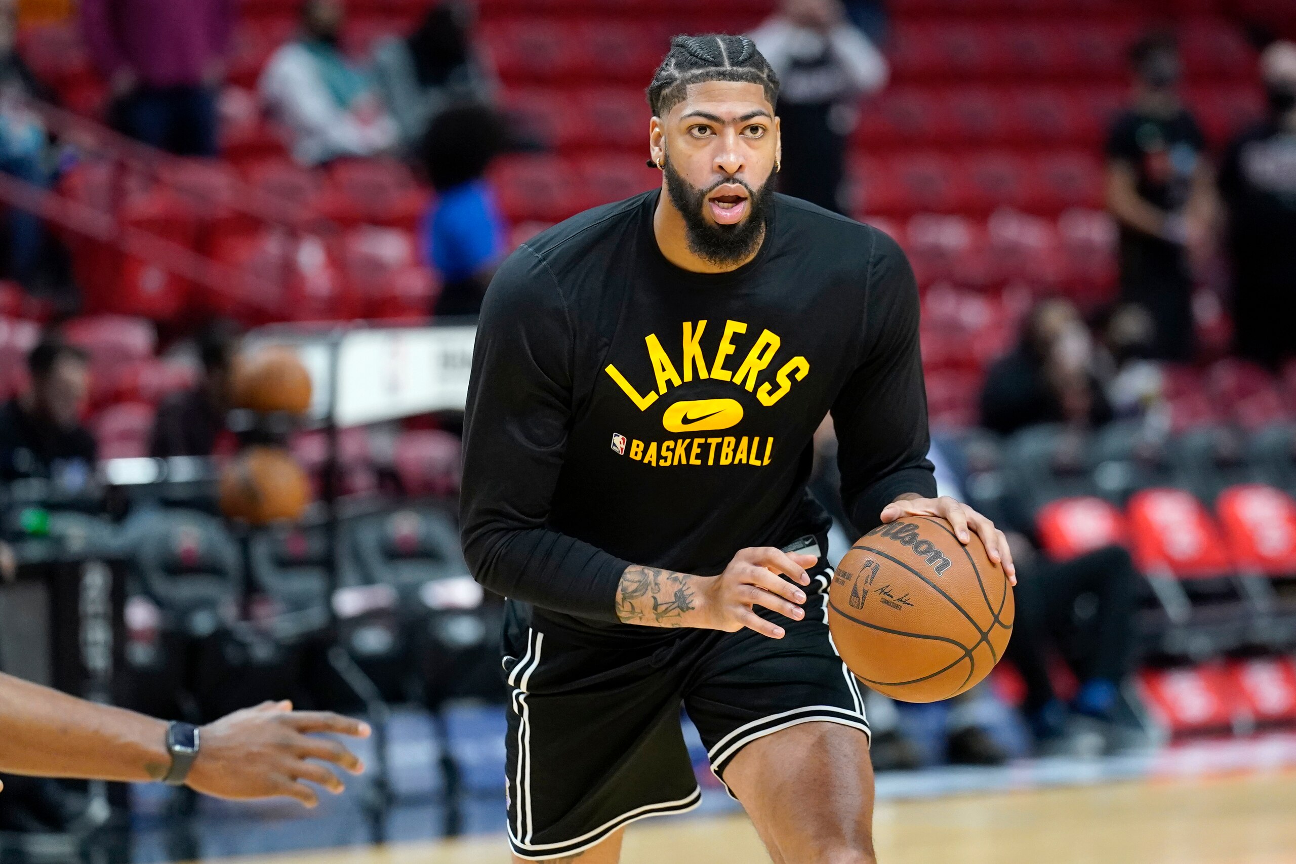 Los Angeles Lakers forward Anthony Davis warms up before an NBA basketball game against the Miami Heat, Sunday, Jan. 23, 2022, in Miami. (AP Photo/Lynne Sladky)