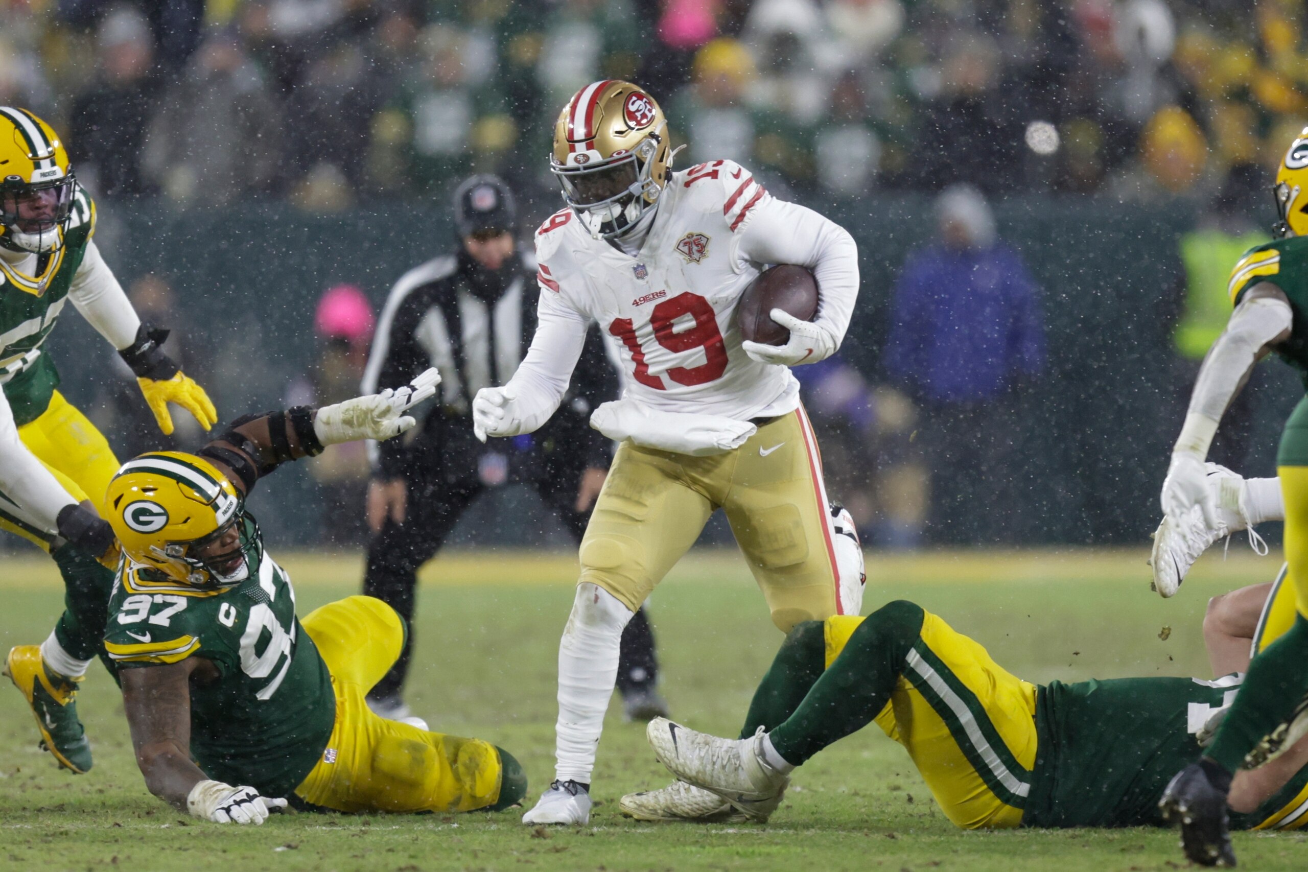 San Francisco 49ers' Deebo Samuel runs during the second half of an NFC divisional playoff NFL football game against the Green Bay Packers Saturday, Jan. 22, 2022, in Green Bay, Wis. (AP Photo/Matt Ludtke) San Francisco 49ers' Deebo Samuel runs during the second half of an NFC divisional playoff NFL football game against the Green Bay Packers Saturday, Jan. 22, 2022, in Green Bay, Wis. (AP Photo/Matt Ludtke)