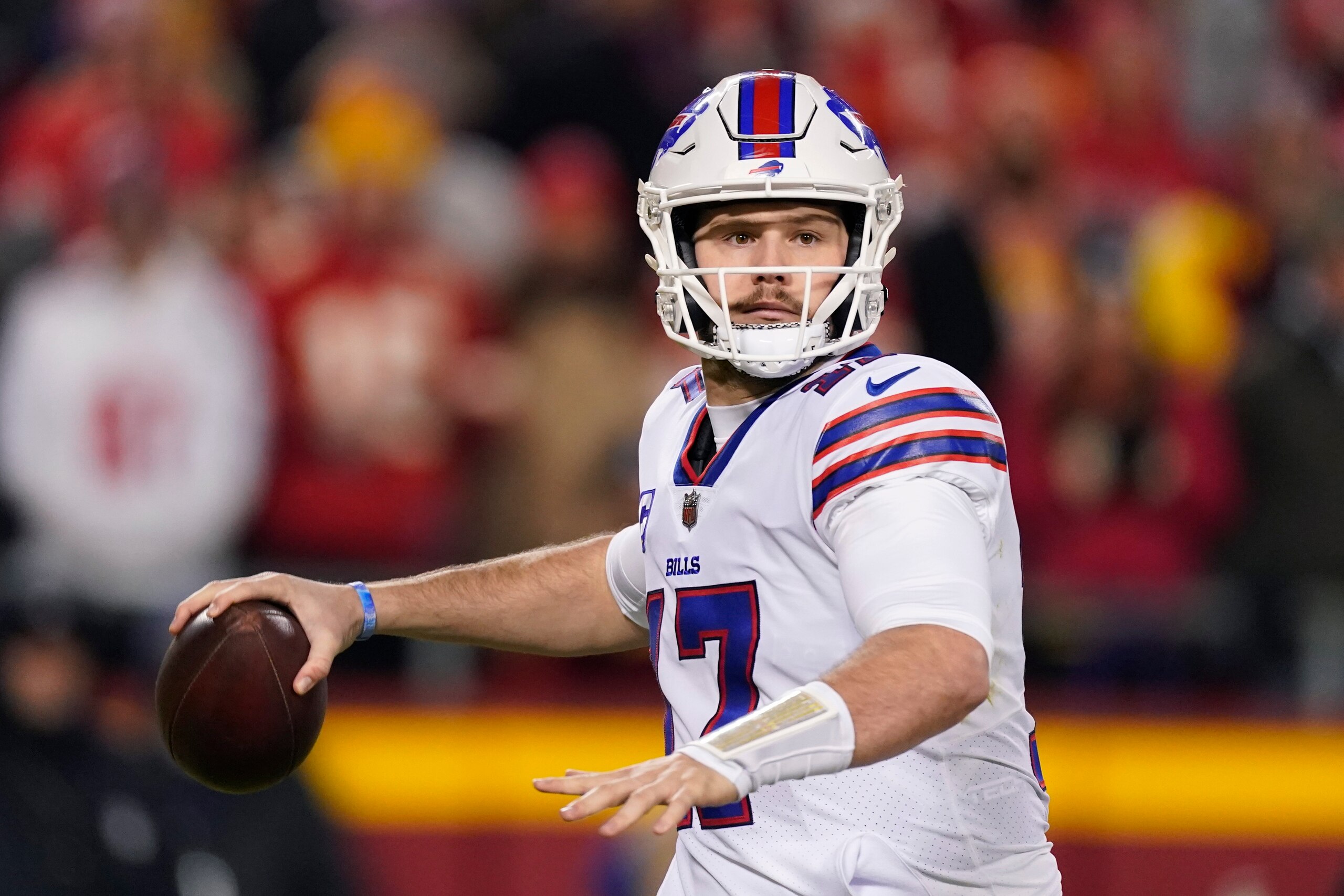 Buffalo Bills quarterback Josh Allen (17) throws a pass during the first half of an NFL divisional round playoff football game against the Kansas City Chiefs, Sunday, Jan. 23, 2022, in Kansas City, Mo. (AP Photo/Charlie Riedel)