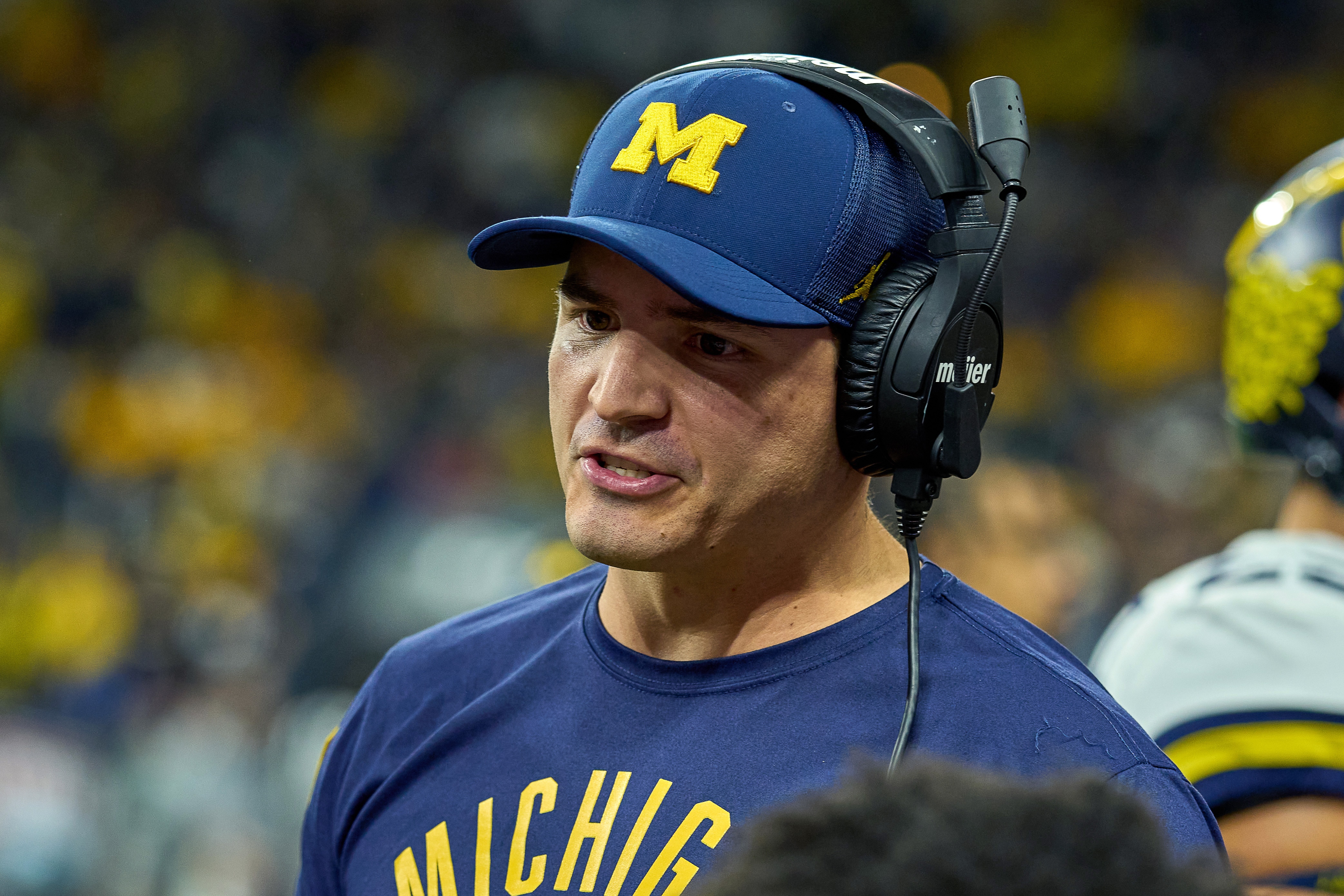 INDIANAPOLIS, IN - DECEMBER 04: Michigan Wolverines Defensive Coordinator Mike Macdonald looks on during the Big Ten Championship Game between the Iowa Hawkeyes and the Michigan Wolverines on December 04, 2021, at Lucas Oil Stadium, in Indianapolis, IL. (Photo by Robin Alam/Icon Sportswire via Getty Images)