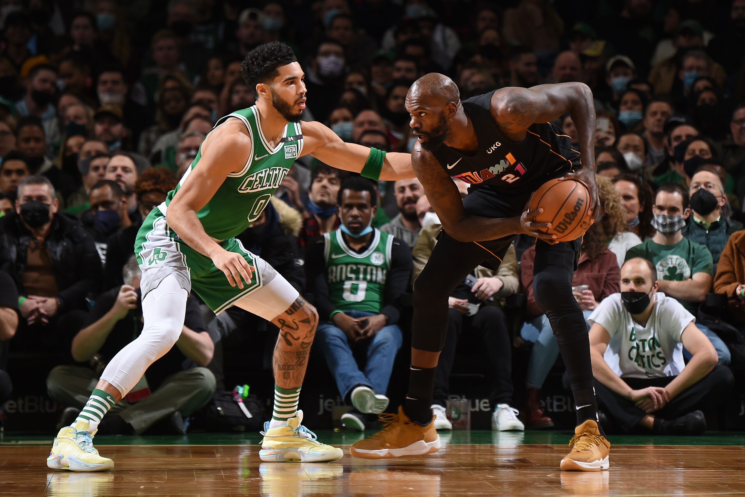 BOSTON, MA - JANUARY 31: Jayson Tatum #0 of the Boston Celtics plays defense on Dewayne Dedmon #21 of the Miami Heat during the game on January 31, 2022 at the TD Garden in Boston, Massachusetts.  NOTE TO USER: User expressly acknowledges and agrees that, by downloading and or using this photograph, User is consenting to the terms and conditions of the Getty Images License Agreement. Mandatory Copyright Notice: Copyright 2022 NBAE  (Photo by Brian Babineau/NBAE via Getty Images)