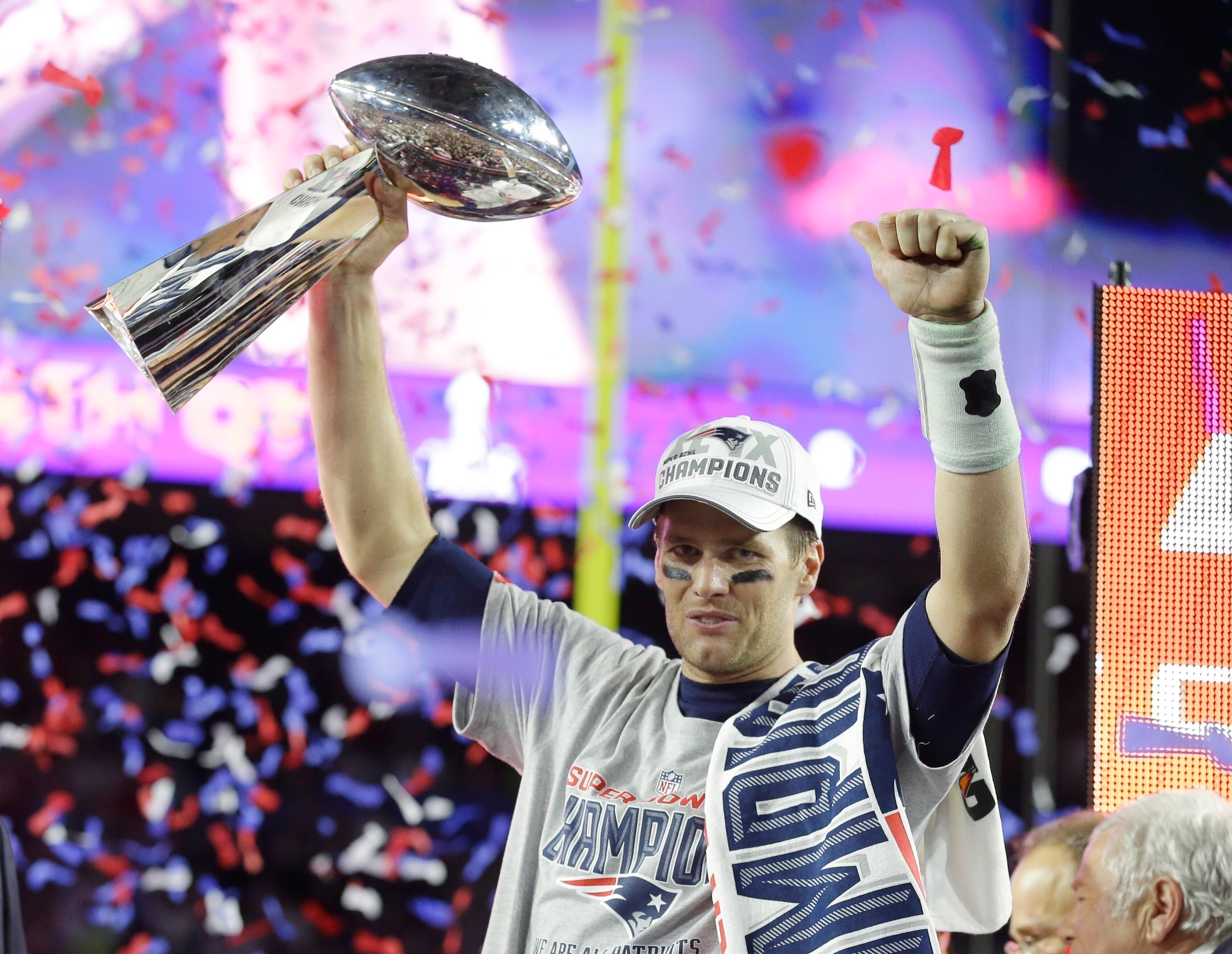 FILE - New England Patriots quarterback Tom Brady celebrates with the Vince Lombardi Trophy after the NFL Super Bowl XLIX football game against the Seattle Seahawks Sunday, Feb. 1, 2015, in Glendale, Ariz. The Patriots won 28-24. Tom Brady has retired after winning seven Super Bowls and setting numerous passing records in an unprecedented 22-year-career. He made the announcement, Tuesday, Feb. 1, 2022, in a long post on Instagram. (AP Photo/Michael Conroy, File)