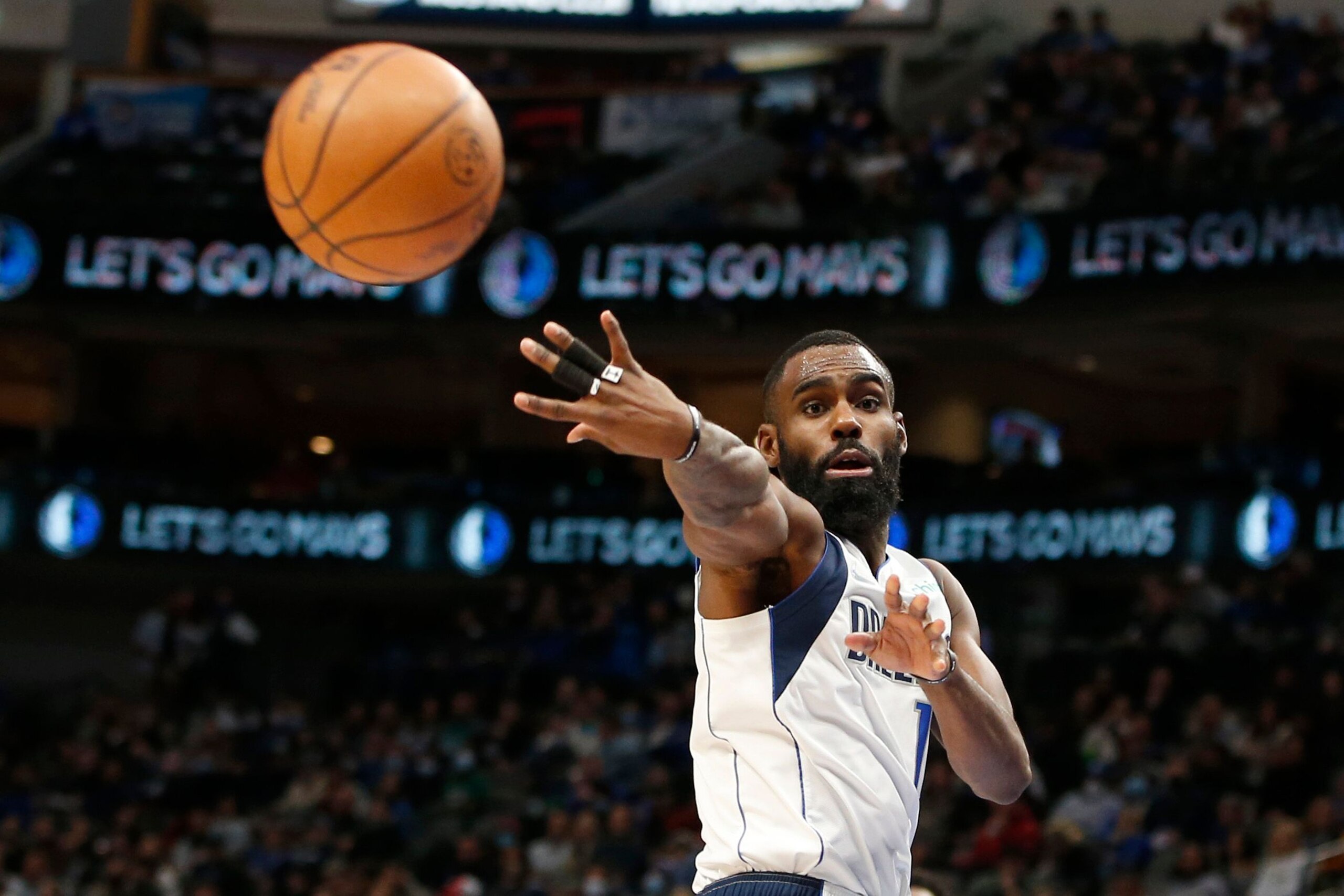 DALLAS, TEXAS - JANUARY 19: Tim Hardaway Jr. #11 of the Dallas Mavericks passes the ball in the second half against the Toronto Raptors at American Airlines Center on January 19, 2022 in Dallas, Texas. NOTE TO USER: User expressly acknowledges and agrees that, by downloading and or using this photograph, User is consenting to the terms and conditions of the Getty Images License Agreement.   (Photo by Tim Heitman/Getty Images)