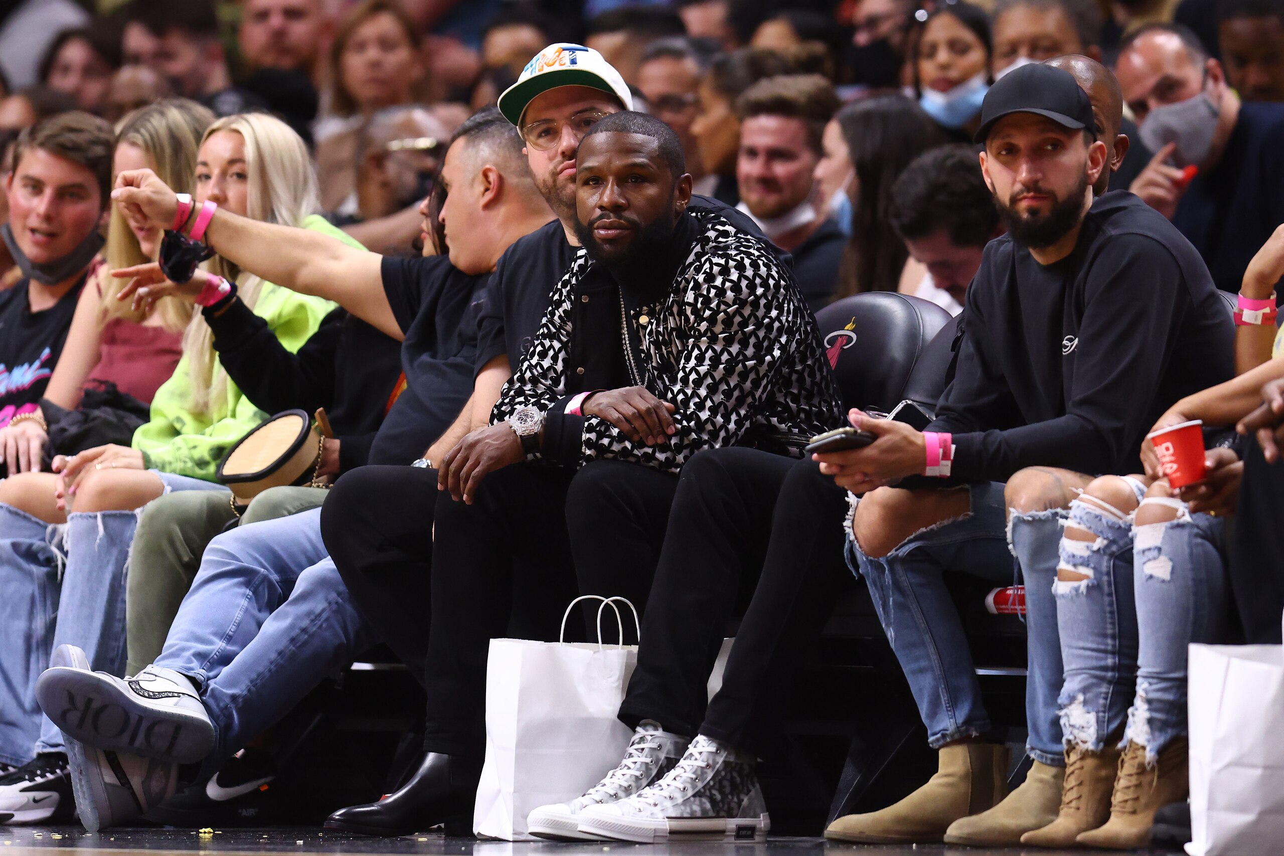 MIAMI, FLORIDA - JANUARY 19: Boxer Floyd Mayweather looks on courtside during the first half between the Miami Heat and the Portland Trail Blazers at FTX Arena on January 19, 2022 in Miami, Florida. NOTE TO USER: User expressly acknowledges and agrees that, by downloading and or using this photograph, User is consenting to the terms and conditions of the Getty Images License Agreement. (Photo by Michael Reaves/Getty Images)