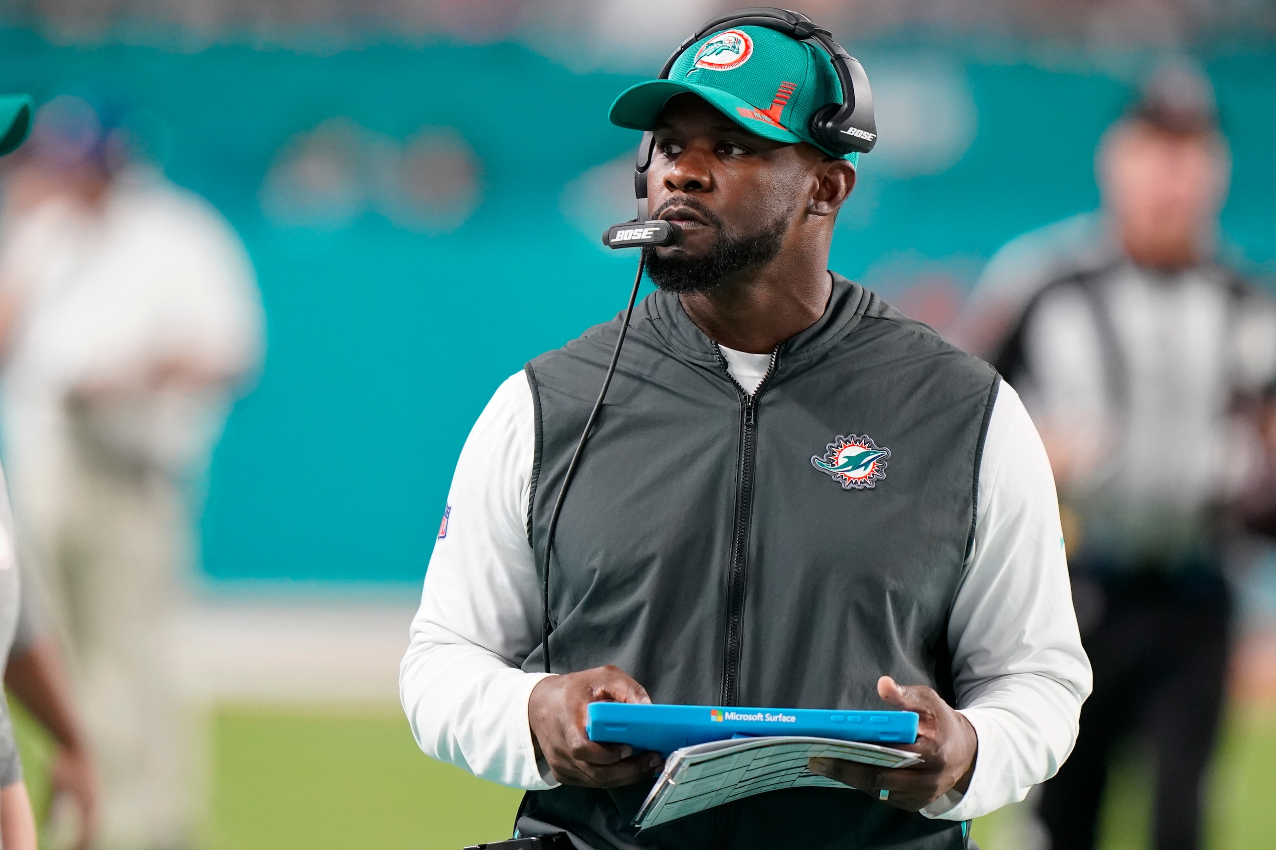Miami Dolphins head coach Brian Flores stands on the sideline during the second half of an NFL football game against the New England Patriots, Sunday, Jan. 9, 2022, in Miami Gardens, Fla. (AP Photo/Wilfredo Lee)