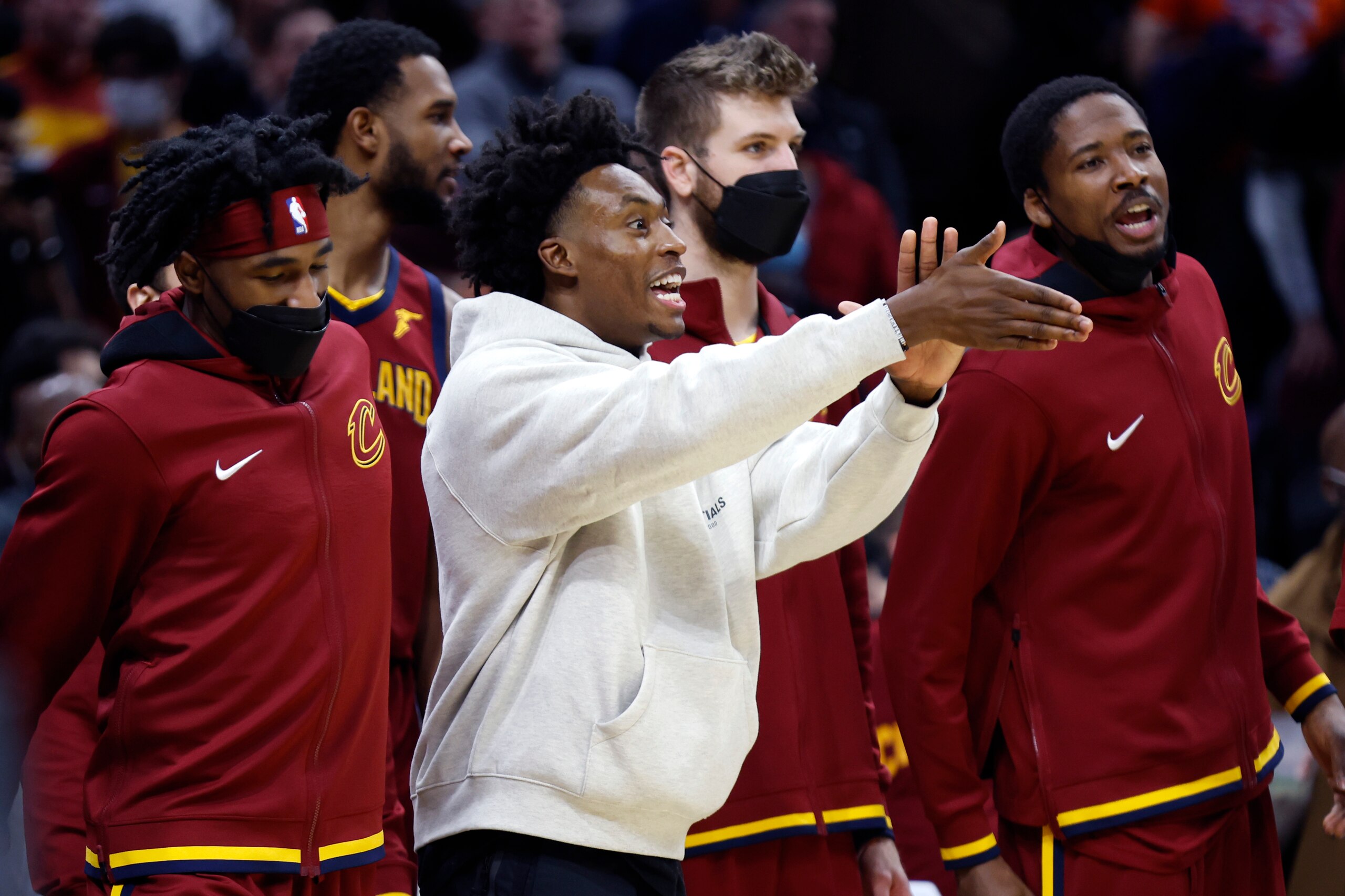 Cleveland Cavaliers' Collin Sexton cheers on his team against the New Orleans Pelicans during the second half of an NBA basketball game, Monday, Jan. 31, 2022, in Cleveland. The Cavaliers defeated the Pelicans 93-90. (AP Photo/Ron Schwane)