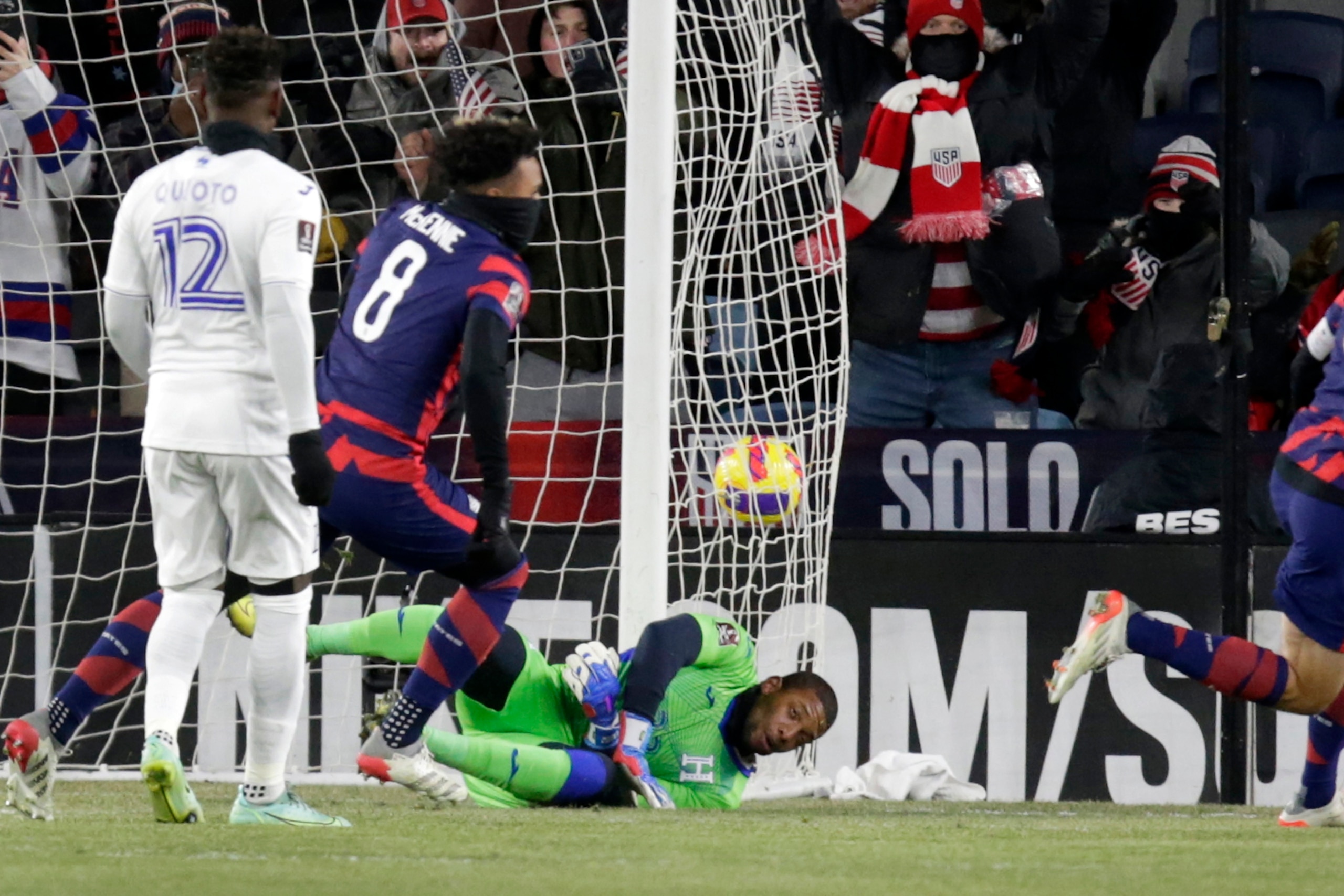 United States' Weston McKennie (8) scores a goal on Honduras goalkeeper Luis Lopez (22) during the first half of a FIFA World Cup qualifying soccer match Wednesday, Feb. 2, 2022, in St. Paul, Minn. (AP Photo/Andy Clayton-King)
