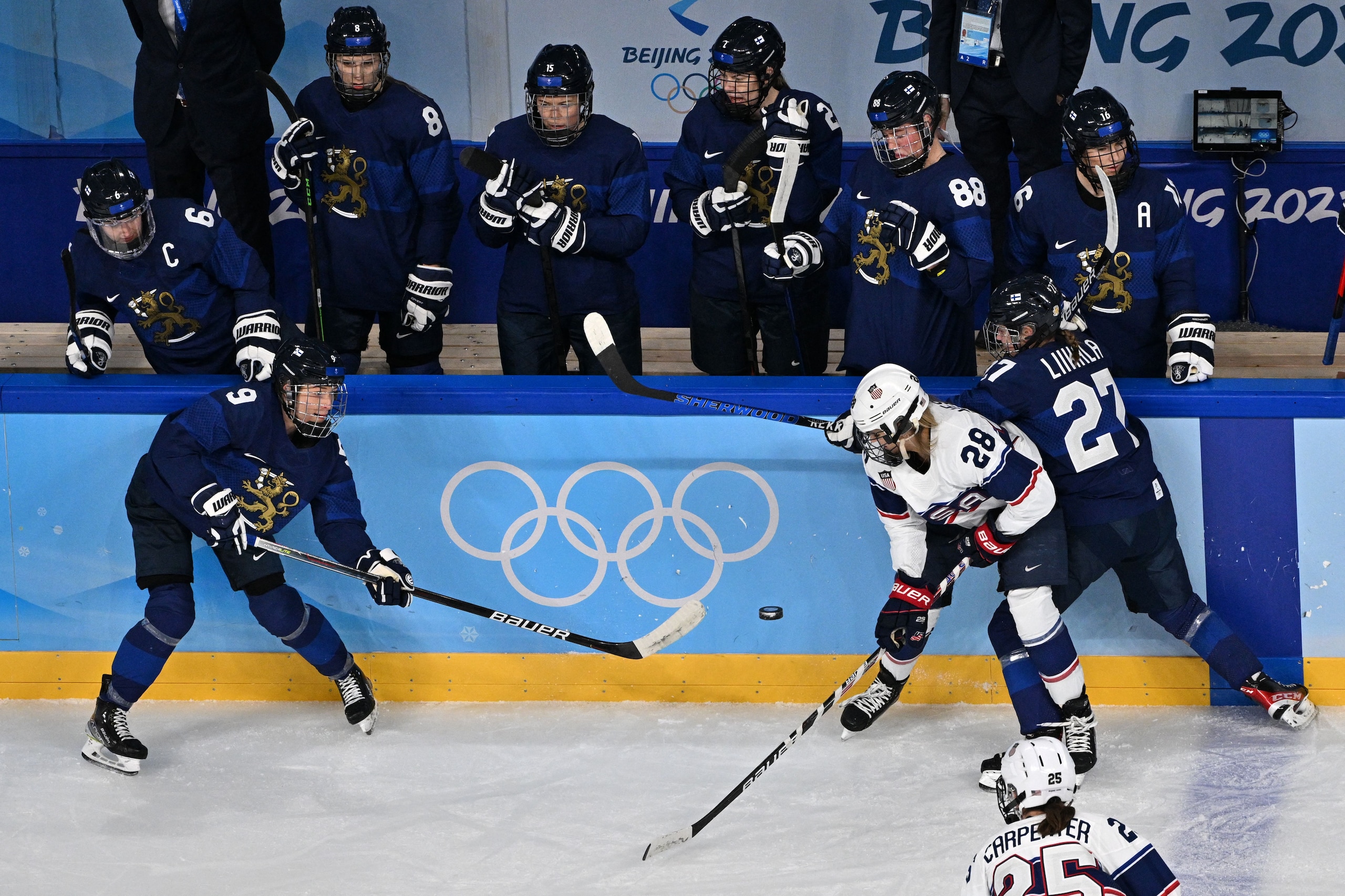 USA's Amanda Kessel (2-R) and Finland's Julia Liikala vie for the puck during their women's preliminary round group A match of the Beijing 2022 Winter Olympic Games ice hockey competition, at the Wukesong Sports Centre in Beijing on February 3, 2022. (Photo by ANTHONY WALLACE / AFP) (Photo by ANTHONY WALLACE/AFP via Getty Images)