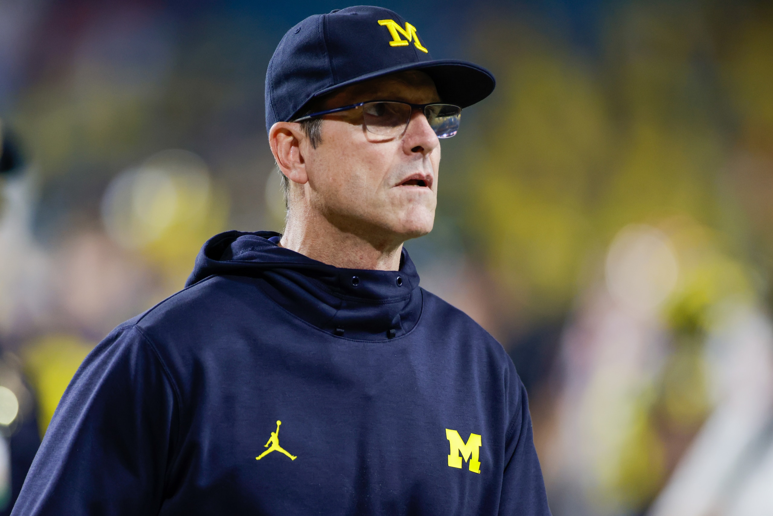 MIAMI GARDENS, FL - DECEMBER 31: Michigan Wolverines head coach Jim Harbaugh during the Capital One Orange Bowl game between the Georgia Bulldogs and the Michigan Wolverines on December 31, 2021 at Hard Rock Stadium in Miami Gardens, Fl. (Photo by David Rosenblum/Icon Sportswire via Getty Images) MIAMI GARDENS, FL - DECEMBER 31: Michigan Wolverines head coach Jim Harbaugh during the Capital One Orange Bowl game between the Georgia Bulldogs and the Michigan Wolverines on December 31, 2021 at Hard Rock Stadium in Miami Gardens, Fl. (Photo by David Rosenblum/Icon Sportswire via Getty Images)
