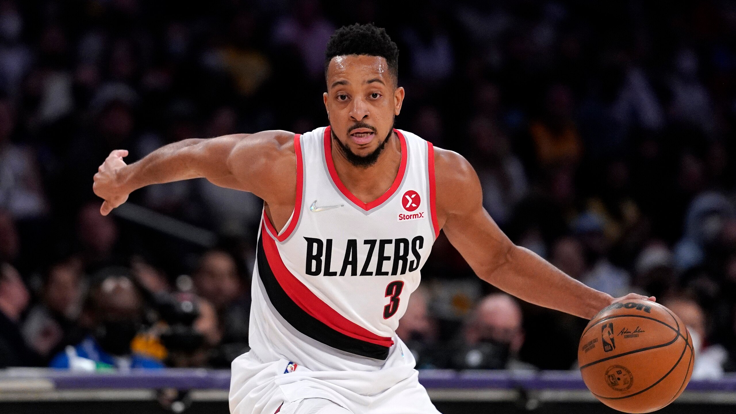 Portland Trail Blazers guard CJ McCollum dribbles during the second half of an NBA basketball game against the Los Angeles Lakers Wednesday, Feb. 2, 2022, in Los Angeles. (AP Photo/Mark J. Terrill)