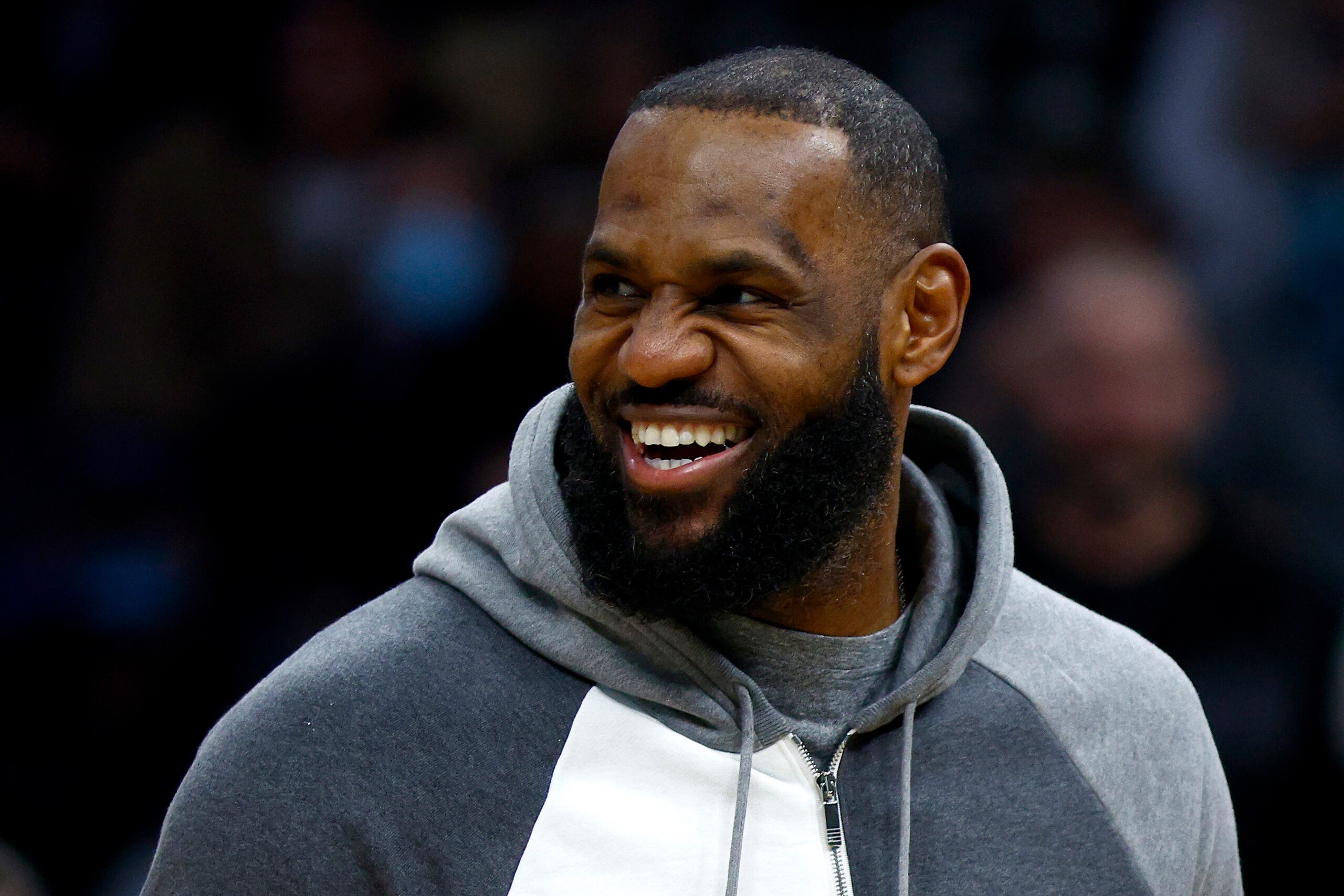 CHARLOTTE, NORTH CAROLINA - JANUARY 28: LeBron James #6 of the Los Angeles Lakers looks on from the sideline during the first half of the game against the Charlotte Hornets at Spectrum Center on January 28, 2022 in Charlotte, North Carolina. NOTE TO USER: User expressly acknowledges and agrees that, by downloading and or using this photograph, User is consenting to the terms and conditions of the Getty Images License Agreement. (Photo by Jared C. Tilton/Getty Images)