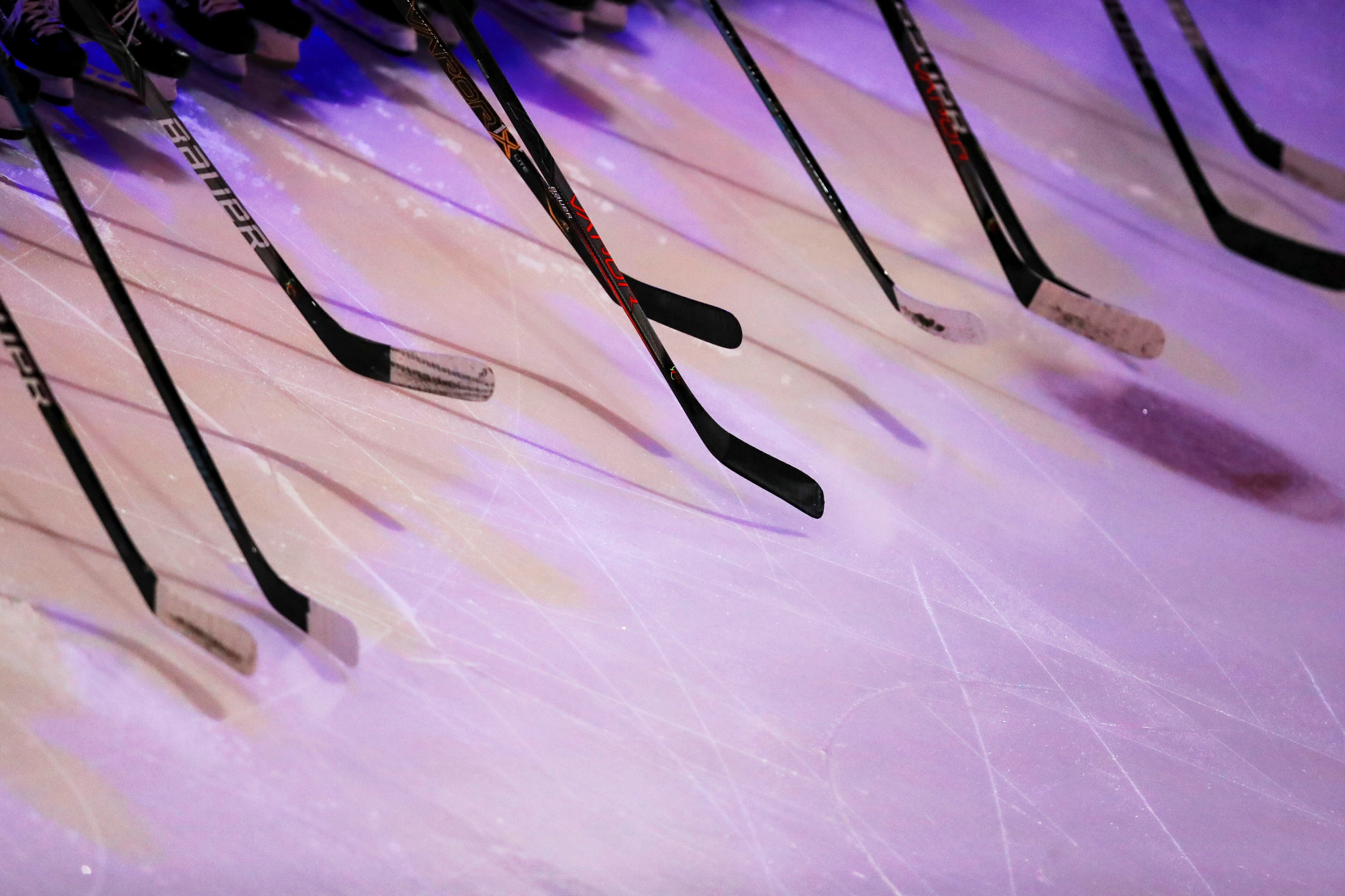 FILE - Ferris State players hold hockey sticks prior to an NCAA hockey game against the Miami RedHawks, on Oct. 18, 2019, in Oxford, Ohio. Before arriving at Miami University in Ohio, as director of hockey operations, Brad Aldrich had been allowed to resign from the Blackhawks over accusations of sexually assaulting a player. A November 2012 sexual assault allegation against Aldrich at Miami led to his resignation. (AP Photo/Aaron Doster, File)