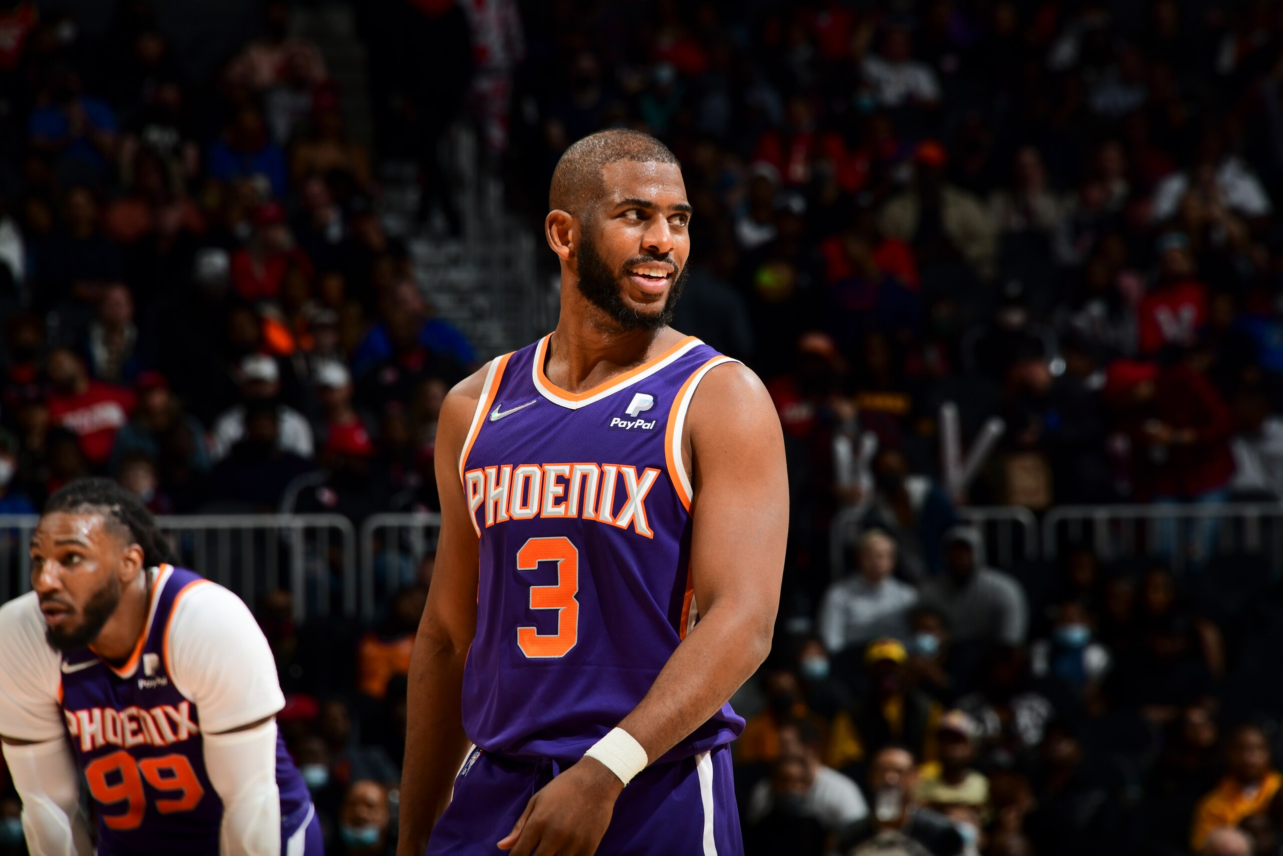 ATLANTA, GA - FEBRUARY 3: Chris Paul #3 of the Phoenix Suns smiles during the game against the Atlanta Hawks on February 3, 2022 at State Farm Arena in Atlanta, Georgia.  NOTE TO USER: User expressly acknowledges and agrees that, by downloading and/or using this Photograph, user is consenting to the terms and conditions of the Getty Images License Agreement. Mandatory Copyright Notice: Copyright 2022 NBAE (Photo by Scott Cunningham/NBAE via Getty Images)
