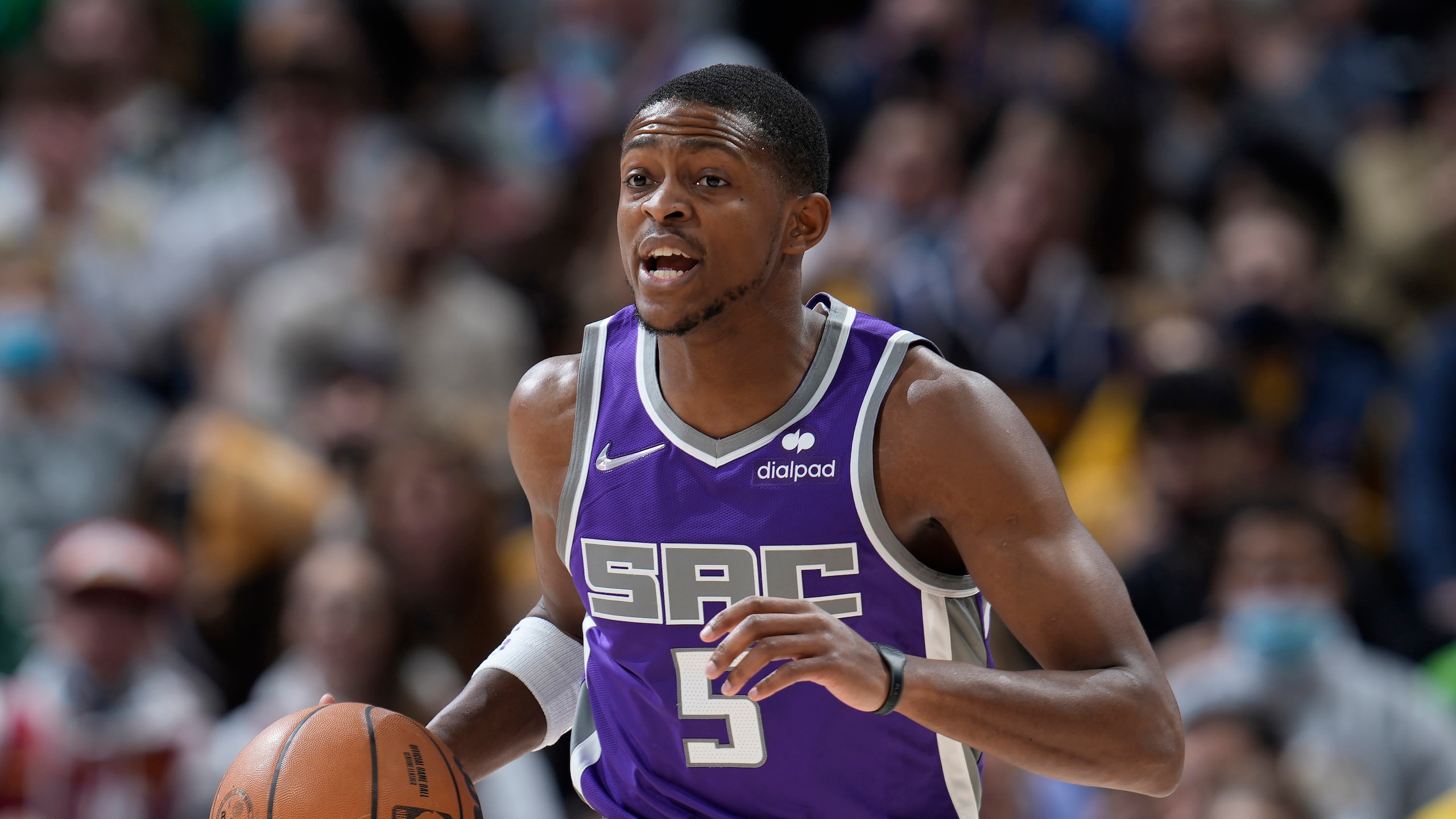 Sacramento Kings guard De'Aaron Fox (5) in the first half of an NBA basketball game Friday, Jan. 7, 2022, in Denver. (AP Photo/David Zalubowski)