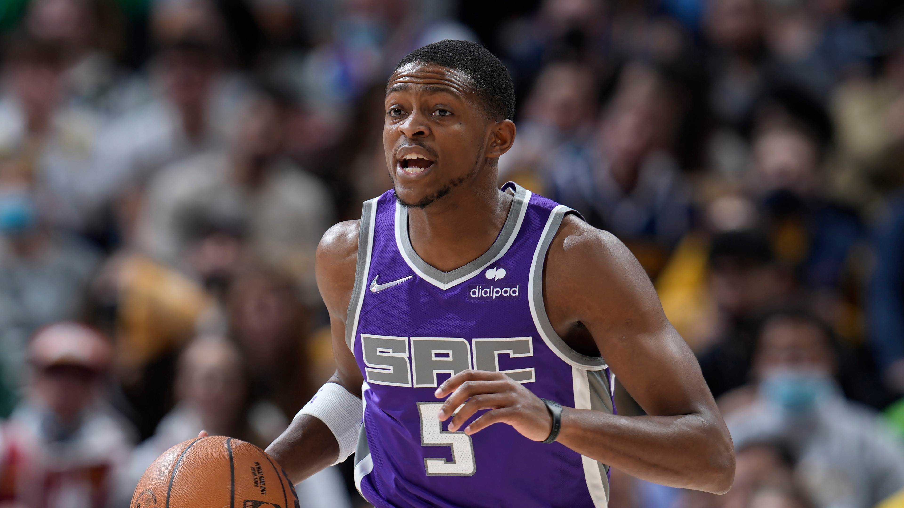 Sacramento Kings guard De'Aaron Fox (5) in the first half of an NBA basketball game Friday, Jan. 7, 2022, in Denver. (AP Photo/David Zalubowski)