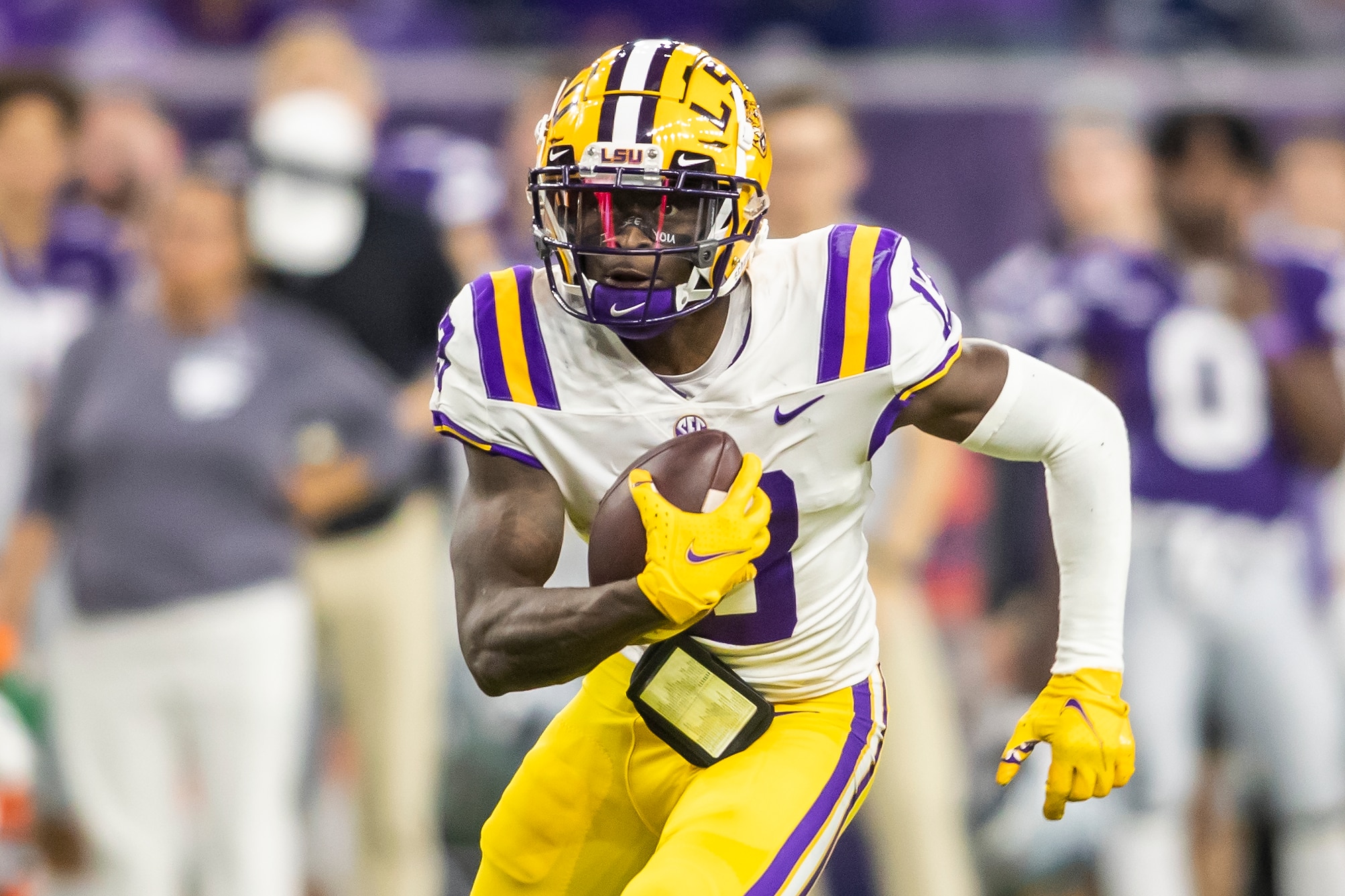 HOUSTON, TX - JANUARY 04: LSU quarterback Jontre Kirklin (13) scrambles the ball up the field during the TaxAct Texas Bowl game between the Kansas State Wildcats and the LSU Tigers on Tuesday January 4th, 2022 at NRG Stadium in Houston, TX.  (Photo by Nick Tre. Smith/Icon Sportswire via Getty Images)
