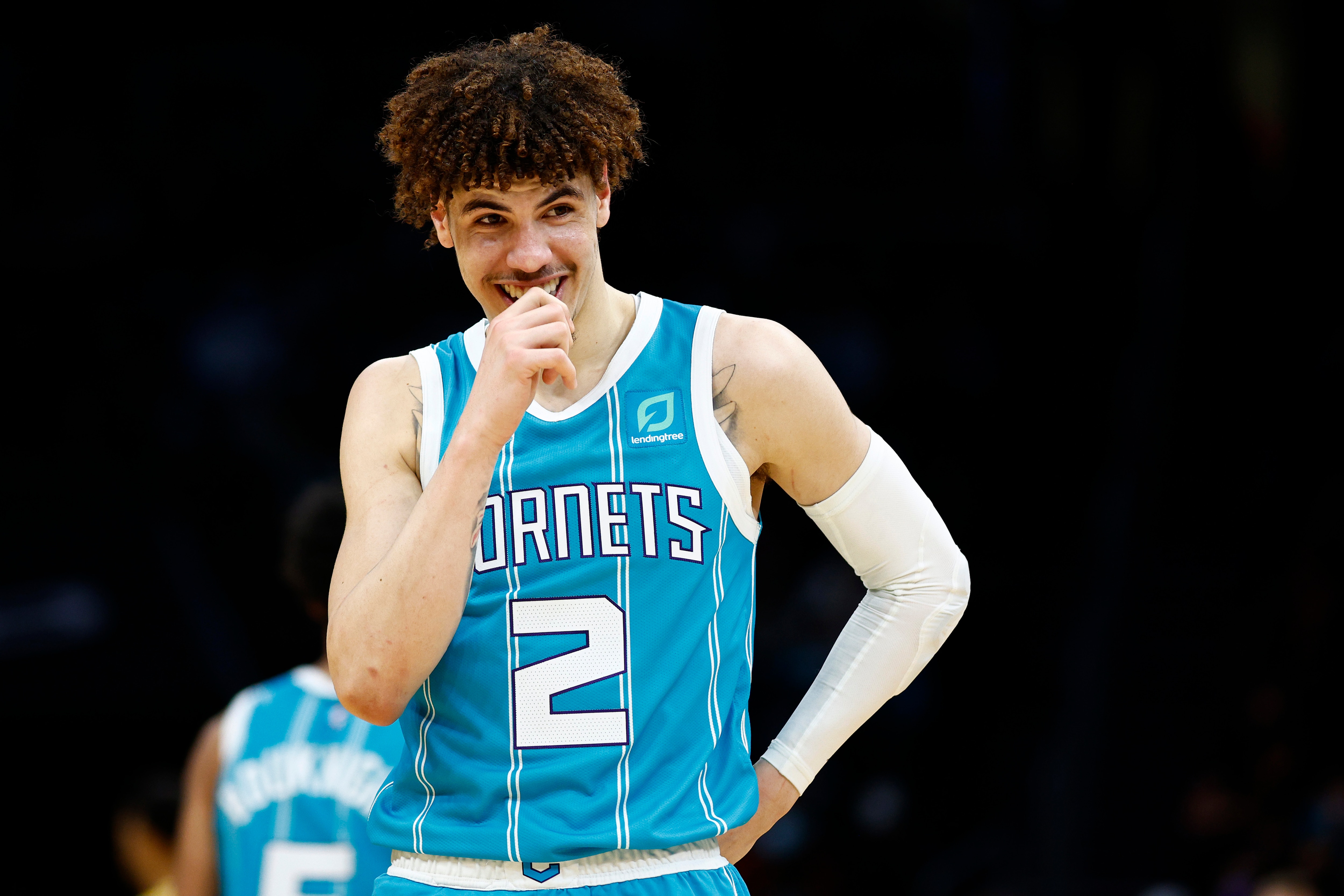 CHARLOTTE, NORTH CAROLINA - JANUARY 28: LaMelo Ball #2 of the Charlotte Hornets reacts during the first half of the game against the Los Angeles Lakers at Spectrum Center on January 28, 2022 in Charlotte, North Carolina. NOTE TO USER: User expressly acknowledges and agrees that, by downloading and or using this photograph, User is consenting to the terms and conditions of the Getty Images License Agreement. (Photo by Jared C. Tilton/Getty Images)