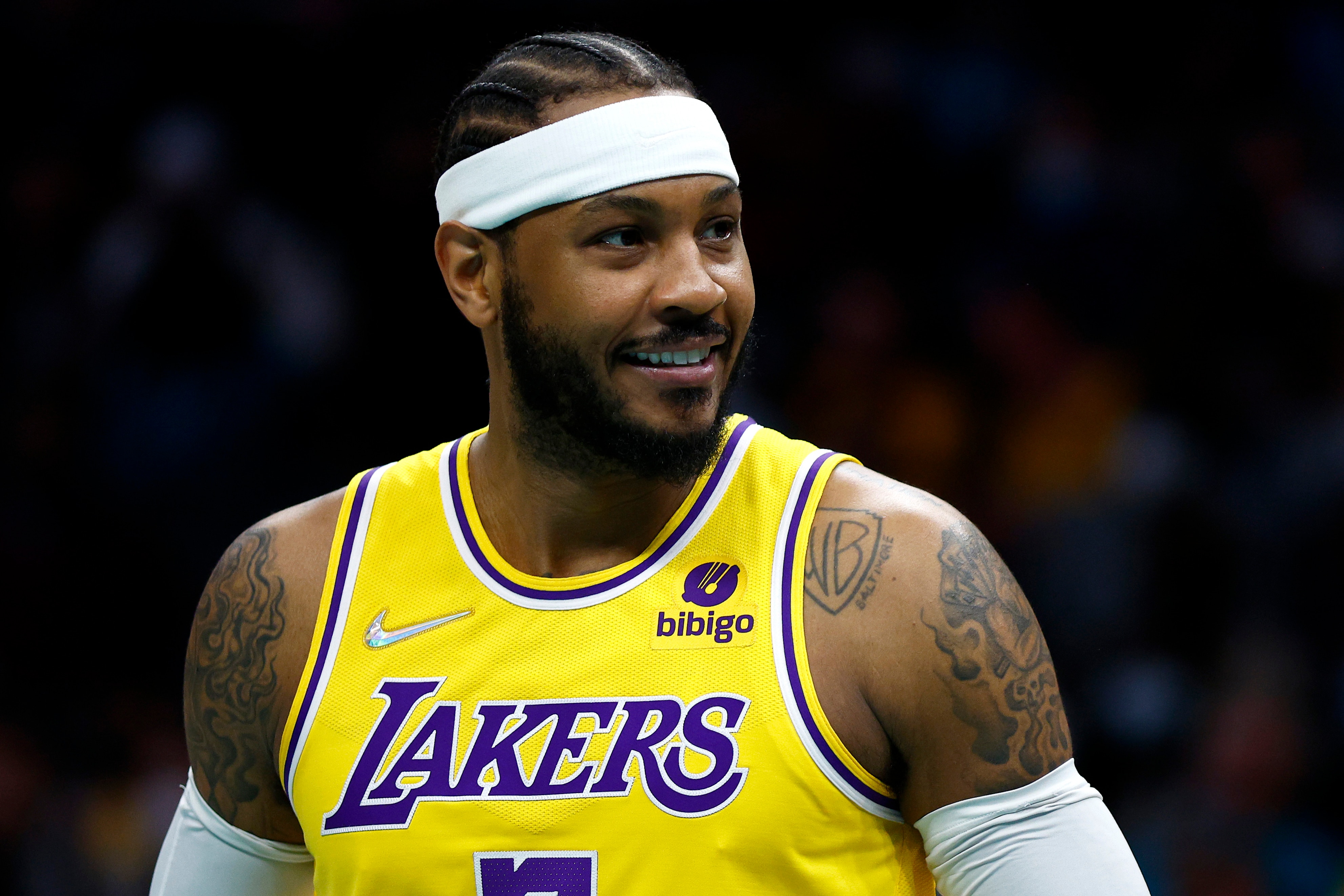 CHARLOTTE, NORTH CAROLINA - JANUARY 28: Carmelo Anthony #7 of the Los Angeles Lakers reacts during the first half of the game against the Charlotte Hornets at Spectrum Center on January 28, 2022 in Charlotte, North Carolina. NOTE TO USER: User expressly acknowledges and agrees that, by downloading and or using this photograph, User is consenting to the terms and conditions of the Getty Images License Agreement. (Photo by Jared C. Tilton/Getty Images)
