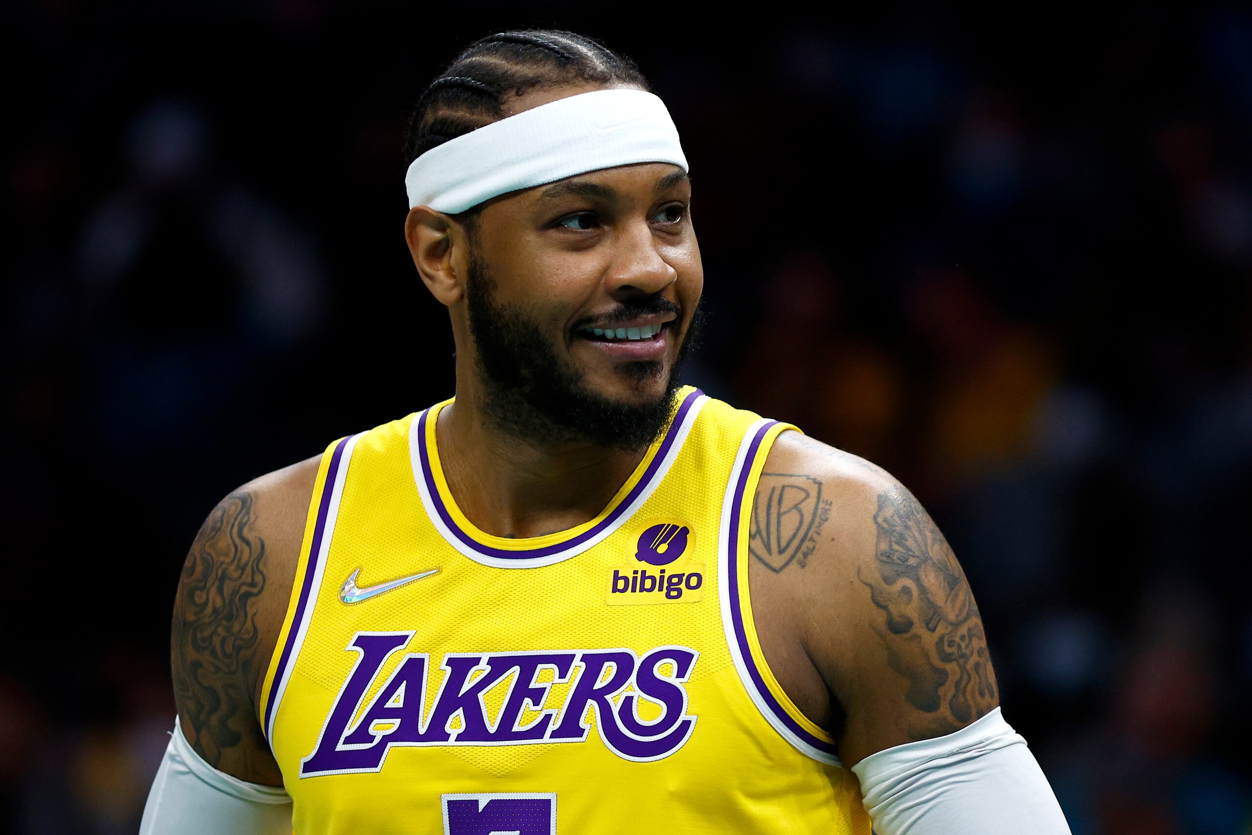 CHARLOTTE, NORTH CAROLINA - JANUARY 28: Carmelo Anthony #7 of the Los Angeles Lakers reacts during the first half of the game against the Charlotte Hornets at Spectrum Center on January 28, 2022 in Charlotte, North Carolina. NOTE TO USER: User expressly acknowledges and agrees that, by downloading and or using this photograph, User is consenting to the terms and conditions of the Getty Images License Agreement. (Photo by Jared C. Tilton/Getty Images)