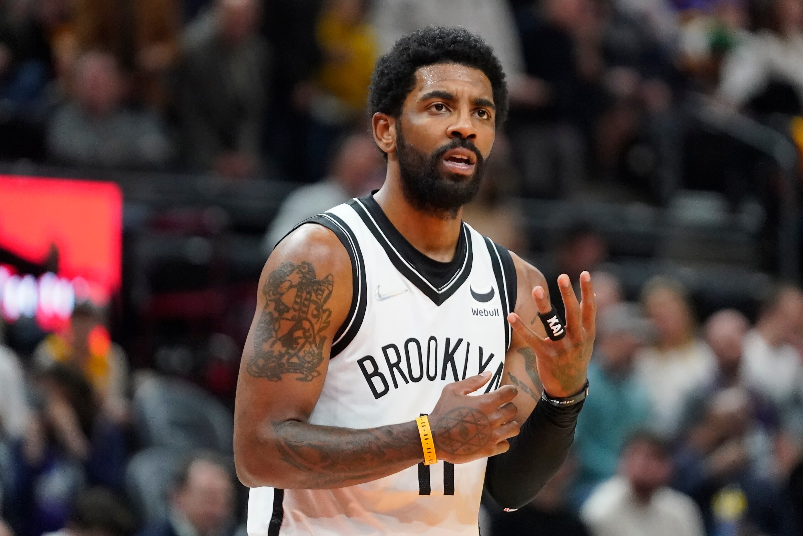 Brooklyn Nets guard Kyrie Irving pauses during the second half of the team's NBA basketball game against the Utah Jazz on Friday, Feb. 4, 2022, in Salt Lake City. (AP Photo/Rick Bowmer)