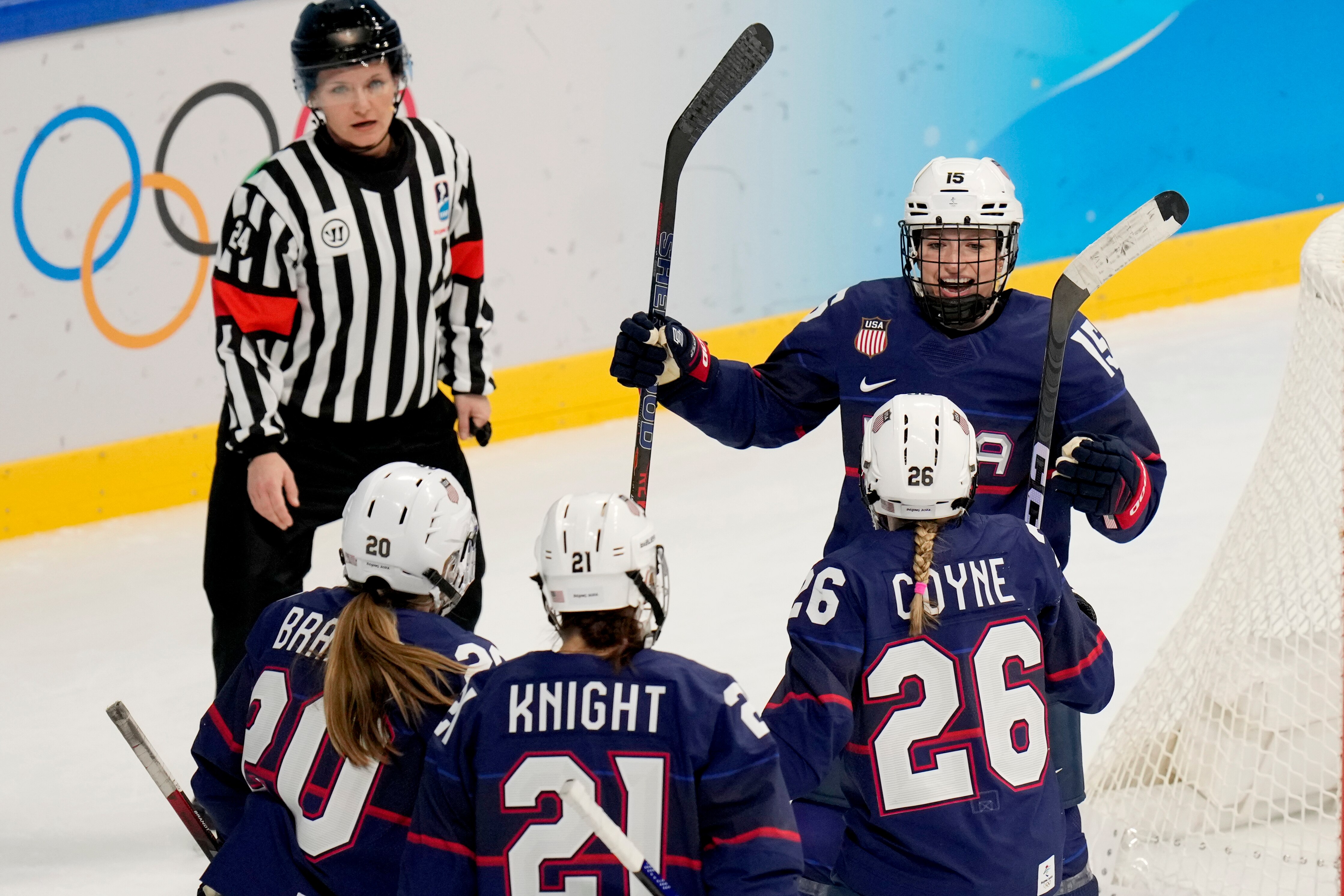 United States' Savannah Harmon (15) celebrates after scoring a goal against Russian Olympic Committee during a preliminary round women's hockey game at the 2022 Winter Olympics, Saturday, Feb. 5, 2022, in Beijing. (AP Photo/Petr David Josek)