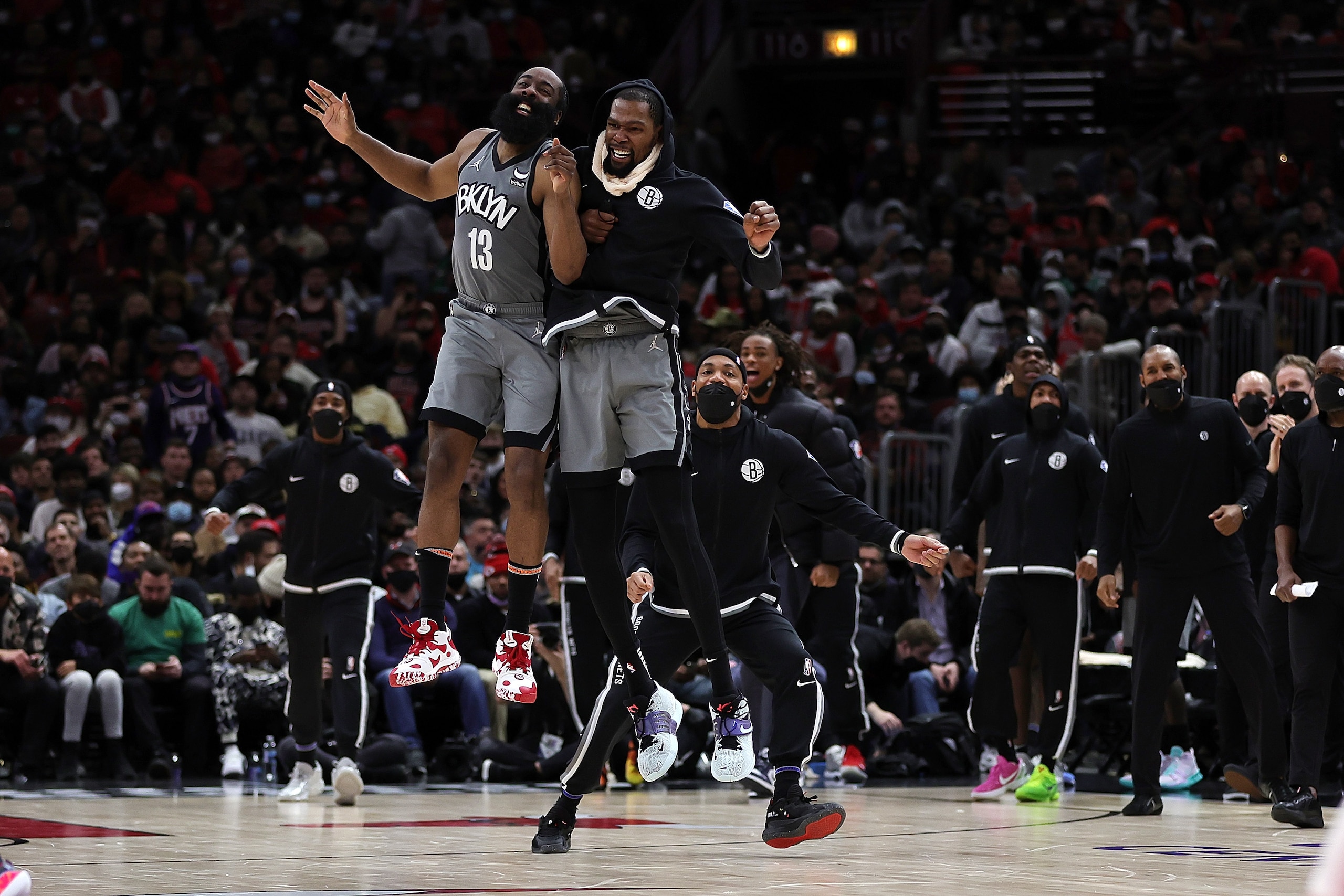 CHICAGO, ILLINOIS - JANUARY 12: James Harden #13 and Kevin Durant #7 of the Brooklyn Nets celebrate after a score during the second half of a game against the Chicago Bulls at United Center on January 12, 2022 in Chicago, Illinois. NOTE TO USER: User expressly acknowledges and agrees that, by downloading and or using this photograph, User is consenting to the terms and conditions of the Getty Images License Agreement. (Photo by Stacy Revere/Getty Images)