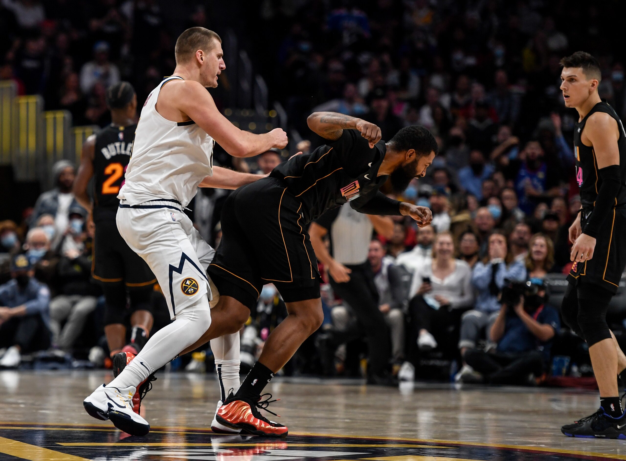 DENVER, CO - NOVEMBER 8: Nikola Jokic (15) of the Denver Nuggets hits Markieff Morris (8) of the Miami Heat with a retaliatory blow after Morris bumped Jokic near mid court during the fourth quarter of Denver"u2019s 113-96 win on Monday, November 8, 2021. The altercation resulted in an ejection for Jokic and a flagrant and two for Morris. (Photo by AAron Ontiveroz/MediaNews Group/The Denver Post via Getty Images)