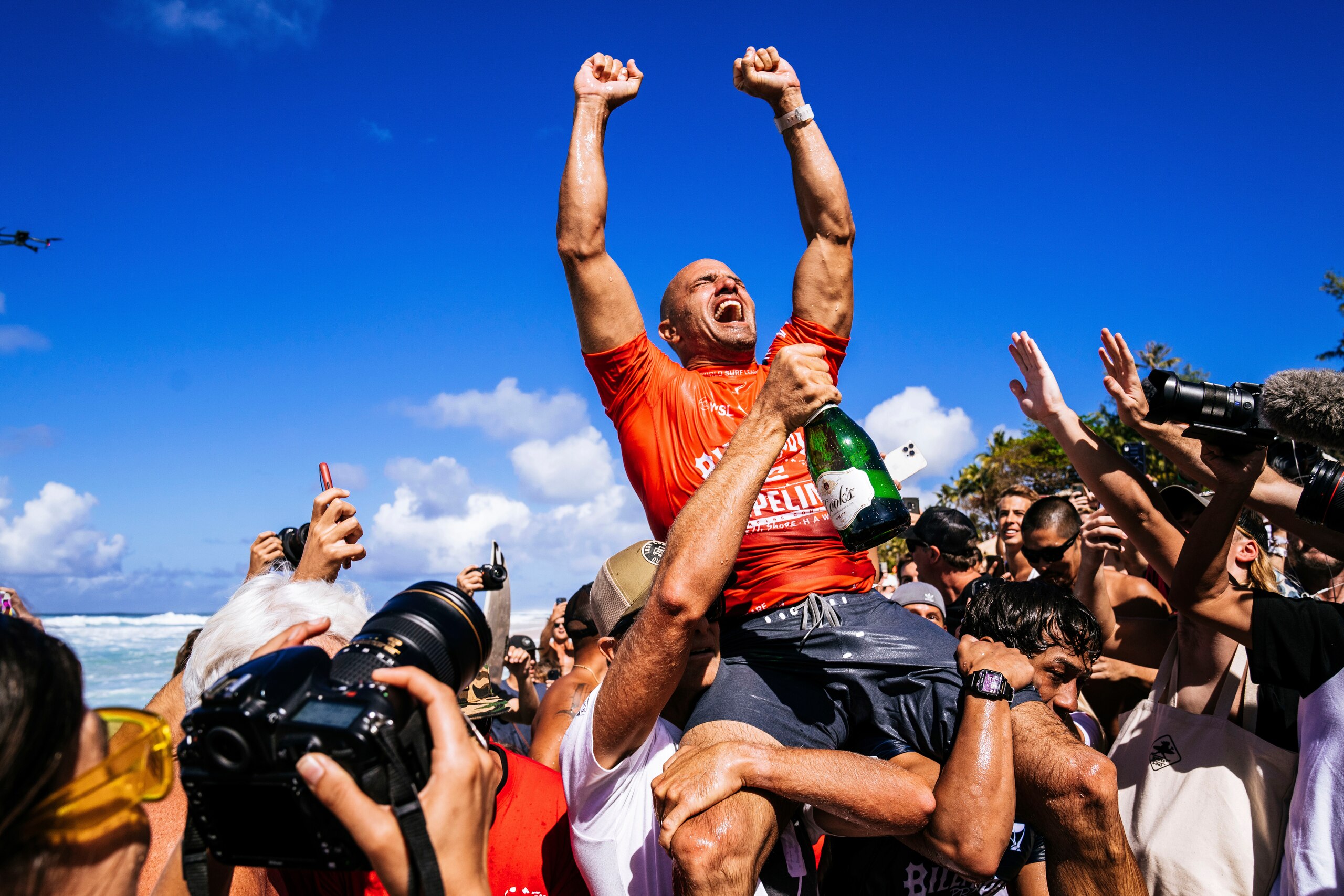 Kelly Slater celebrates after winning the Billabong Pro Pipeline on Feb. 5, 2022, in Haleiwa, Hawaii. Slater won the contest just short of his 50th birthday. (Brady Lawrence/World Surf League via AP)