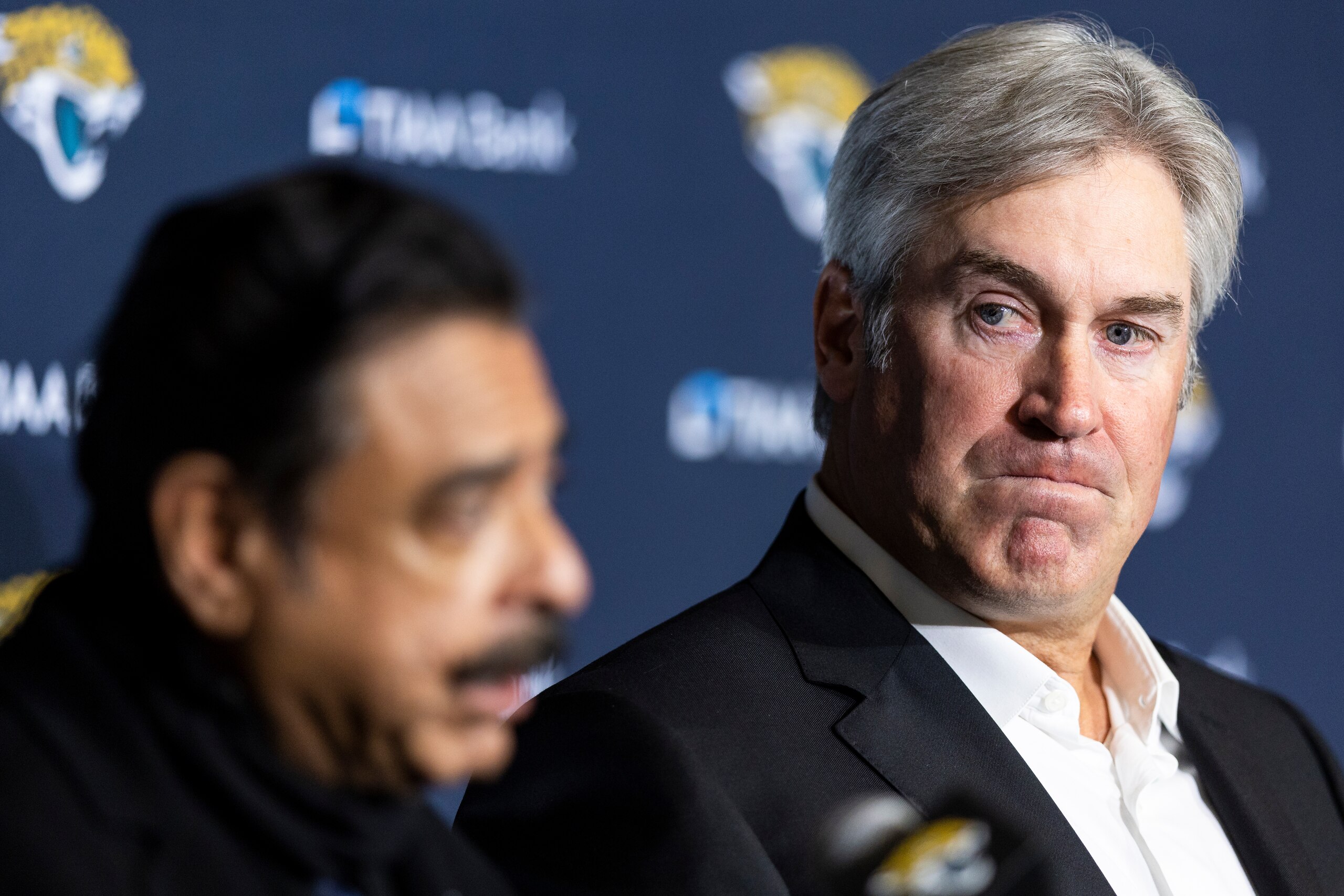 JACKSONVILLE, FLORIDA - FEBRUARY 05: Doug Pederson looks on as Shad Khan, Owner of the Jacksonville Jaguars, speaks during a press conference introducing him as the new head coach of the Jacksonville Jaguars at TIAA Bank Stadium on February 05, 2022 in Jacksonville, Florida. (Photo by James Gilbert/Getty Images) JACKSONVILLE, FLORIDA - FEBRUARY 05: Doug Pederson looks on as Shad Khan, Owner of the Jacksonville Jaguars, speaks during a press conference introducing him as the new head coach of the Jacksonville Jaguars at TIAA Bank Stadium on February 05, 2022 in Jacksonville, Florida. (Photo by James Gilbert/Getty Images)