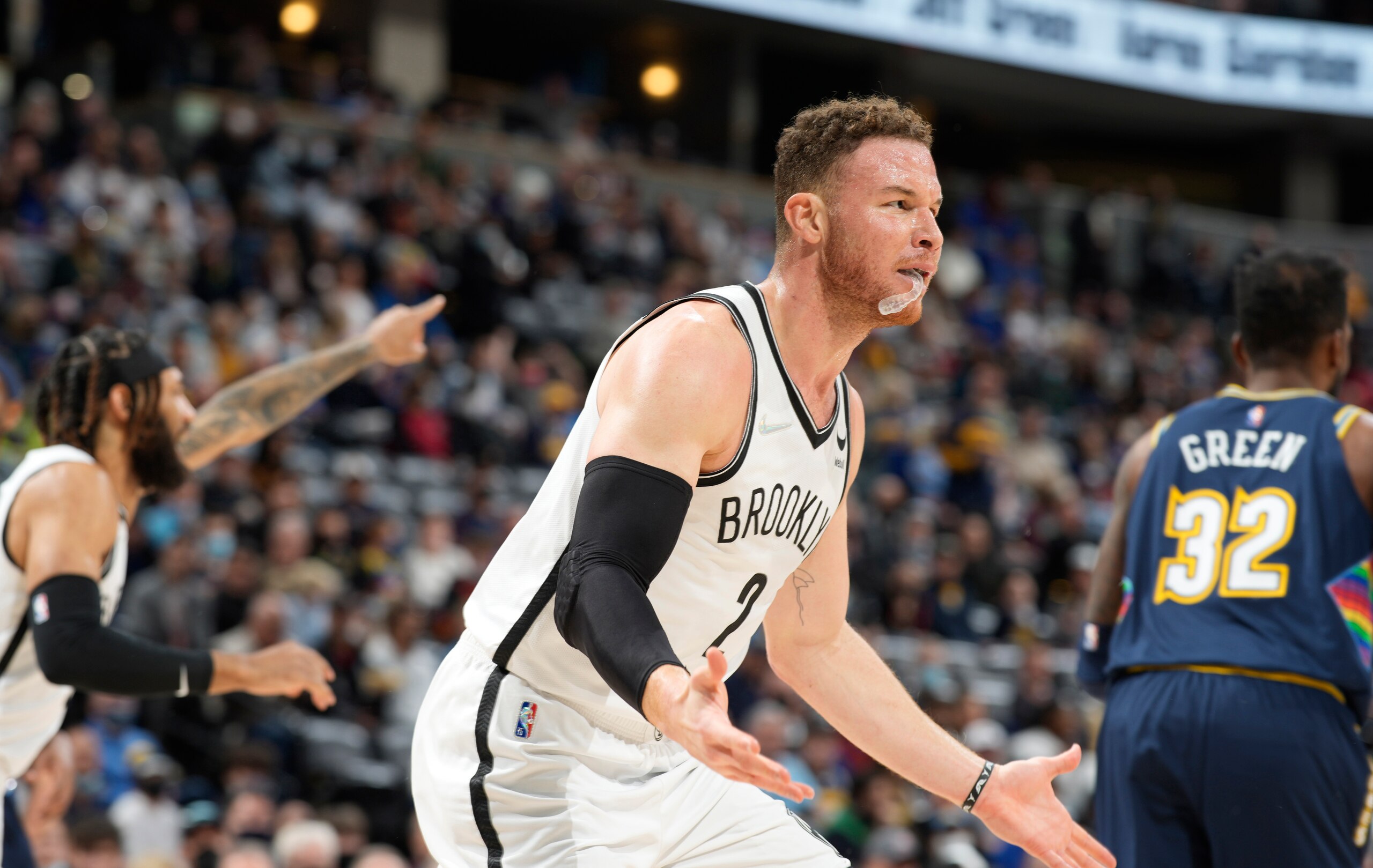 Brooklyn Nets forward Blake Griffin argues with referees for a call in the first half of an NBA basketball game against the Denver Nuggets, Sunday, Feb. 6, 2022, in Denver. (AP Photo/David Zalubowski)
