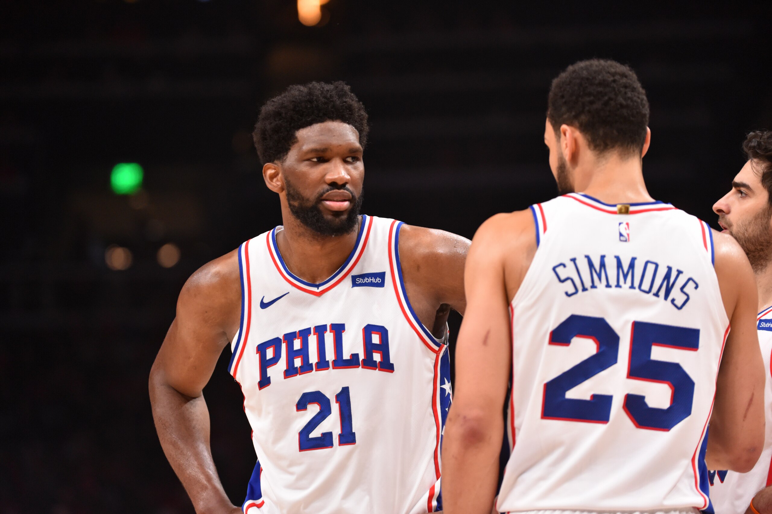 ATLANTA, GA - JUNE 18: Joel Embiid #21 of the Philadelphia 76ers and Ben Simmons #25 of the Philadelphia 76ers talk during a game against the Atlanta Hawks during Round 2, Game 6 of the Eastern Conference Playoffs on June 18, 2021 at State Farm Arena in Atlanta, Georgia. NOTE TO USER: User expressly acknowledges and agrees that, by downloading and/or using this Photograph, user is consenting to the terms and conditions of the Getty Images License Agreement. Mandatory Copyright Notice: Copyright 2021 NBAE (Photo by Jesse D. Garrabrant/NBAE via Getty Images)