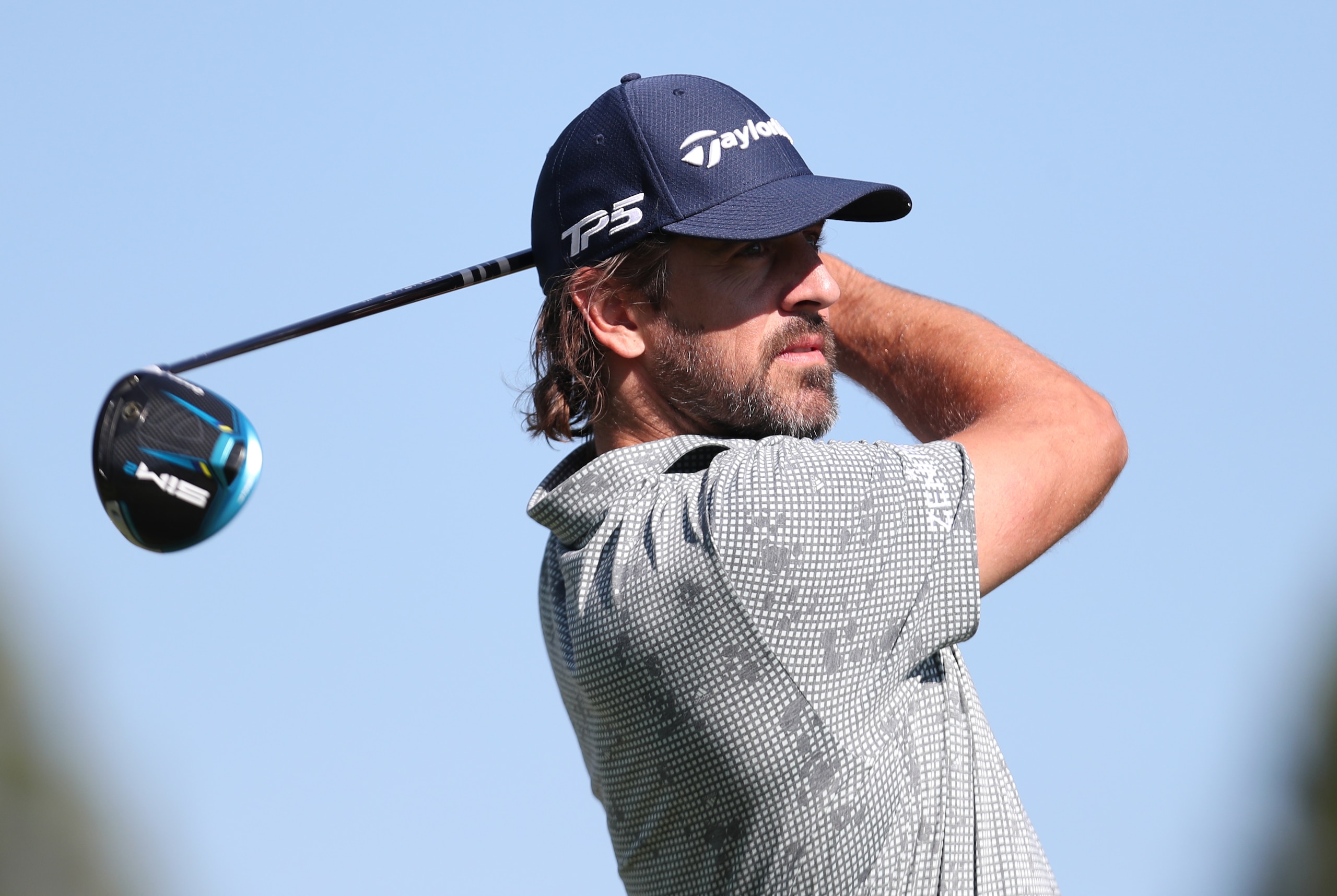 SOUTH LAKE TAHOE, NEVADA - JULY 10: NFL athlete Aaron Rodgers tees off on the first hole during round two of the American Century Championship at Edgewood Tahoe South golf course on July 10, 2020 in South Lake Tahoe, Nevada.  (Photo by Jed Jacobsohn/Getty Images)