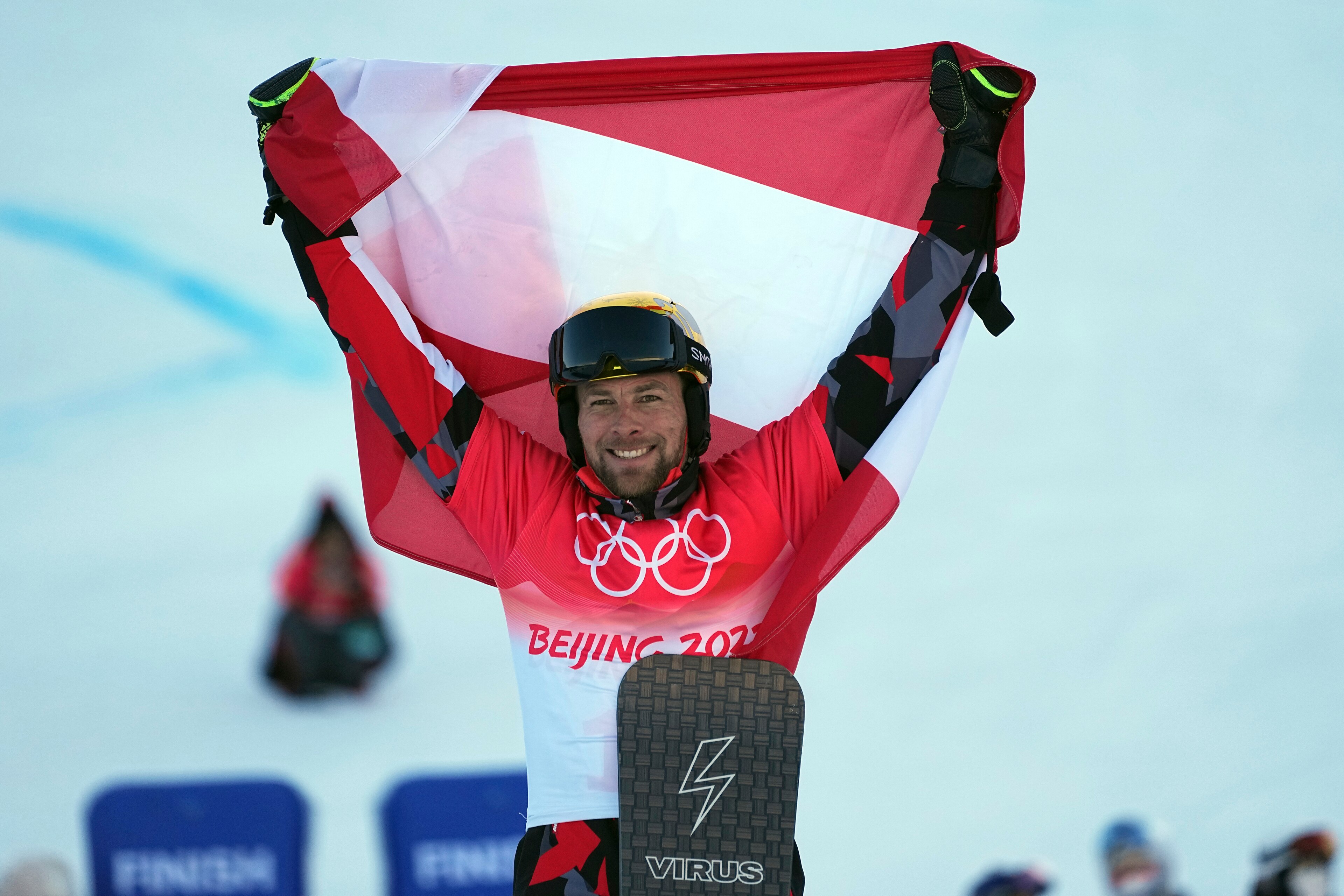 Gold medalist Austria's Benjamin Karl celebrates during the venue ceremony for the men's parallel giant slalom at the 2022 Winter Olympics, Tuesday, Feb. 8, 2022, in Zhangjiakou, China. (AP Photo/Gregory Bull) Gold medalist Austria's Benjamin Karl celebrates during the venue ceremony for the men's parallel giant slalom at the 2022 Winter Olympics, Tuesday, Feb. 8, 2022, in Zhangjiakou, China. (AP Photo/Gregory Bull)