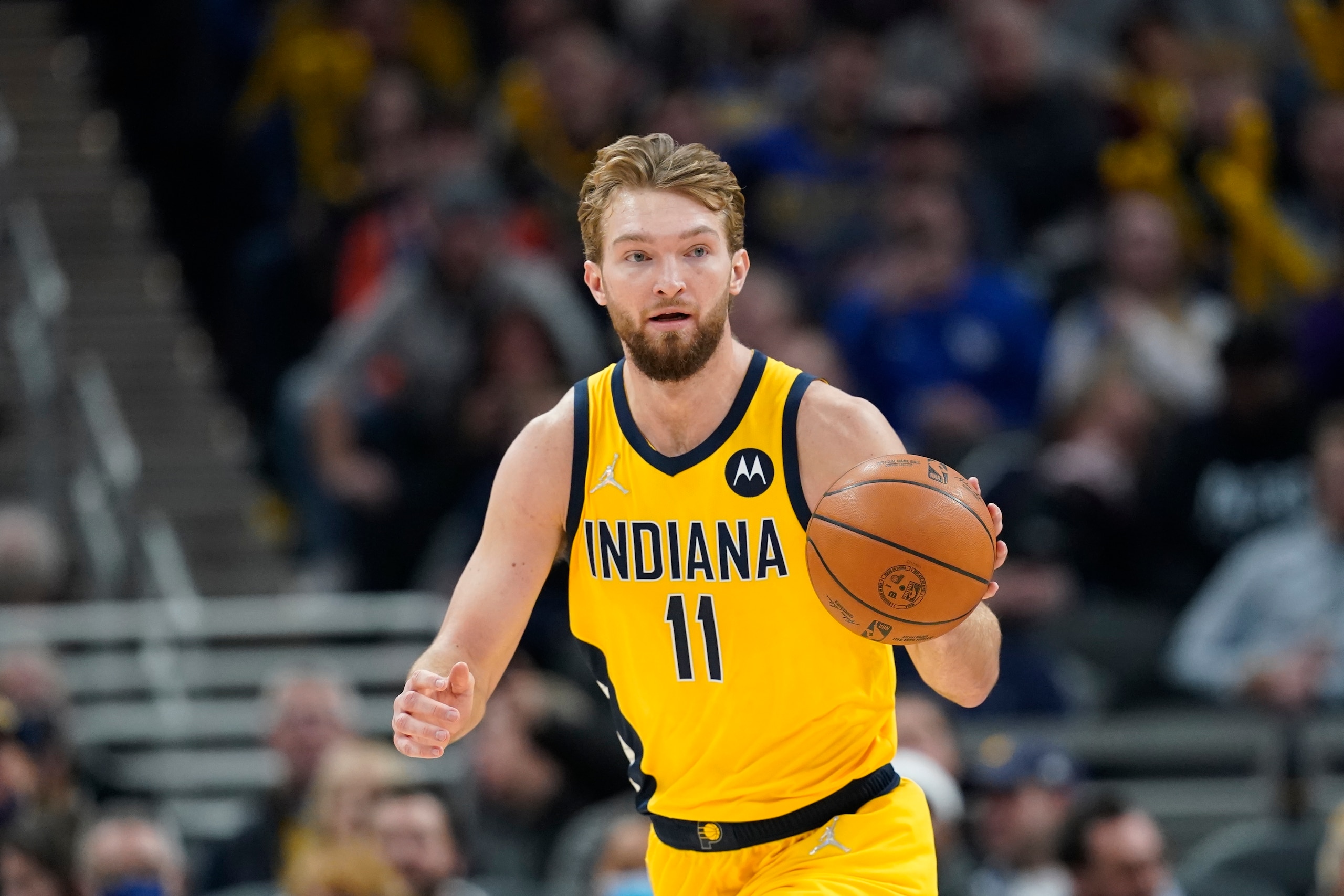 Indiana Pacers' Domantas Sabonis (11) dribbles during the first half of an NBA basketball game against the Phoenix Suns, Friday, Jan. 14, 2022, in Indianapolis. (AP Photo/Darron Cummings)