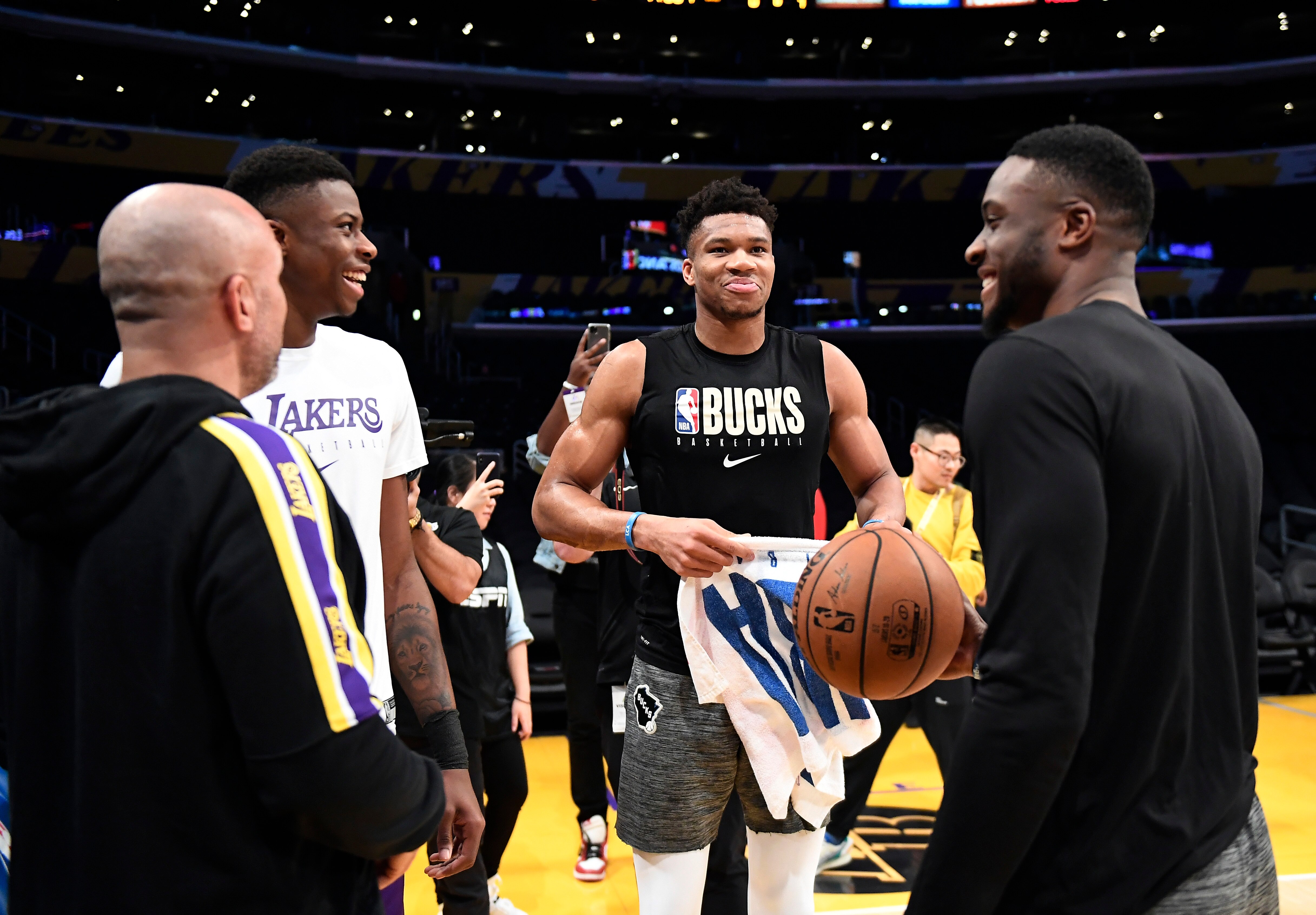 LOS ANGELES, CA - MARCH 06: Giannis Antetokounmpo #34 of the Milwaukee Bucks and his brothers Kostas Antetokounmpo #37 of the Los Angeles Lakers and Thanasis Antetokounmpo #43 of the Milwaukee Bucks speaks with L akers assistant coach Jason prior to the start of a basketball game against Los Angeles Lakers at Staples Center on March 6, 2020 in Los Angeles, California. NOTE TO USER: User expressly acknowledges and agrees that, by downloading and/or using this Photograph, user is consenting to the terms and conditions of the Getty Images License Agreement. (Photo by Kevork Djansezian/Getty Images)