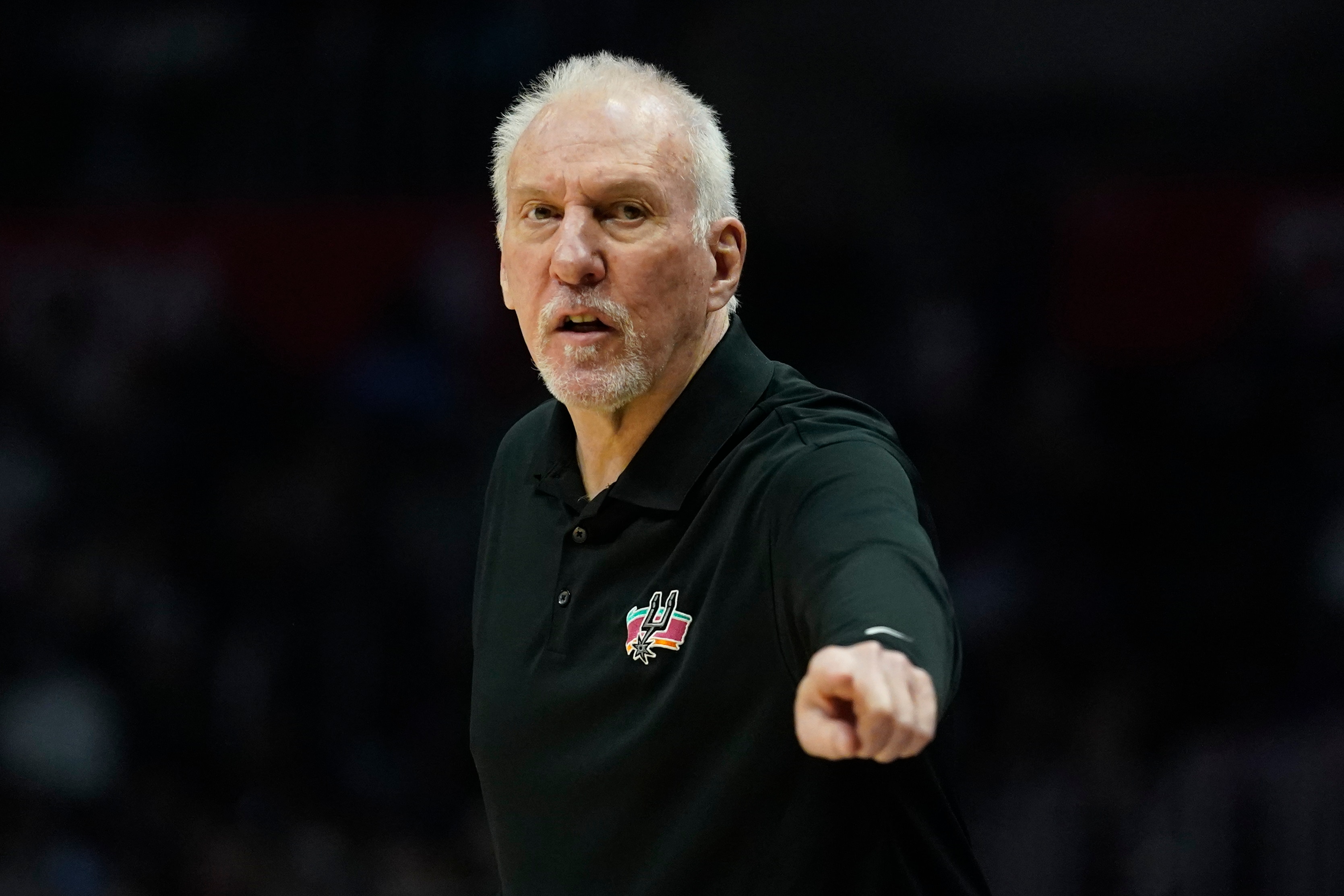 San Antonio Spurs head coach Gregg Popovich points from the sideline during the first half of an NBA basketball game between the San Antonio Spurs and the Los Angeles Clippers in Los Angeles, Monday, Dec. 20, 2021. (AP Photo/Ashley Landis)