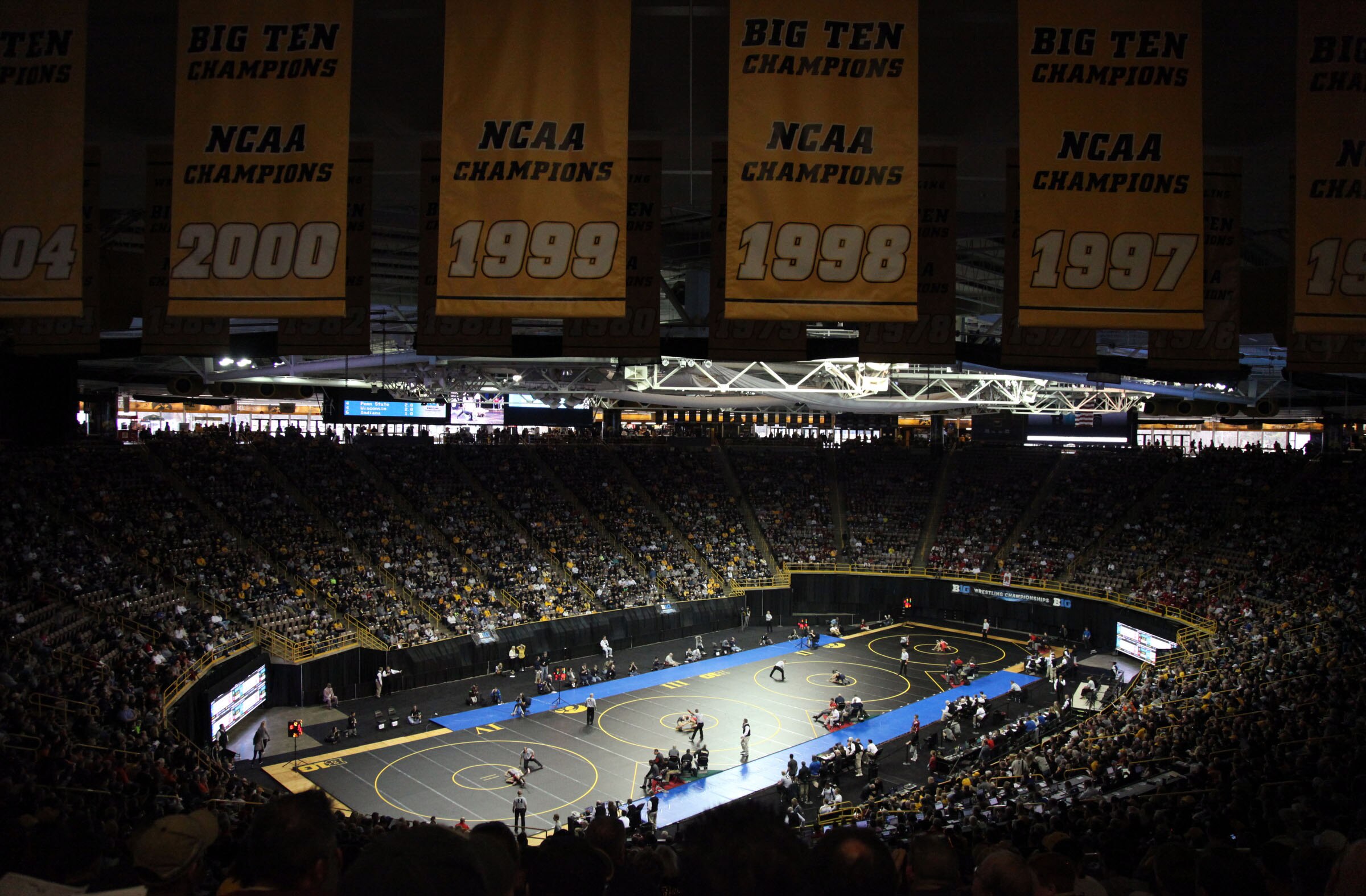 Wrestlers compete during the opening session of the Big Ten Wrestling Championships at Carver-Hawkeye Arena in Iowa City, Iowa, on Saturday, March 5, 2016. (AP Photo/Matthew Holst)